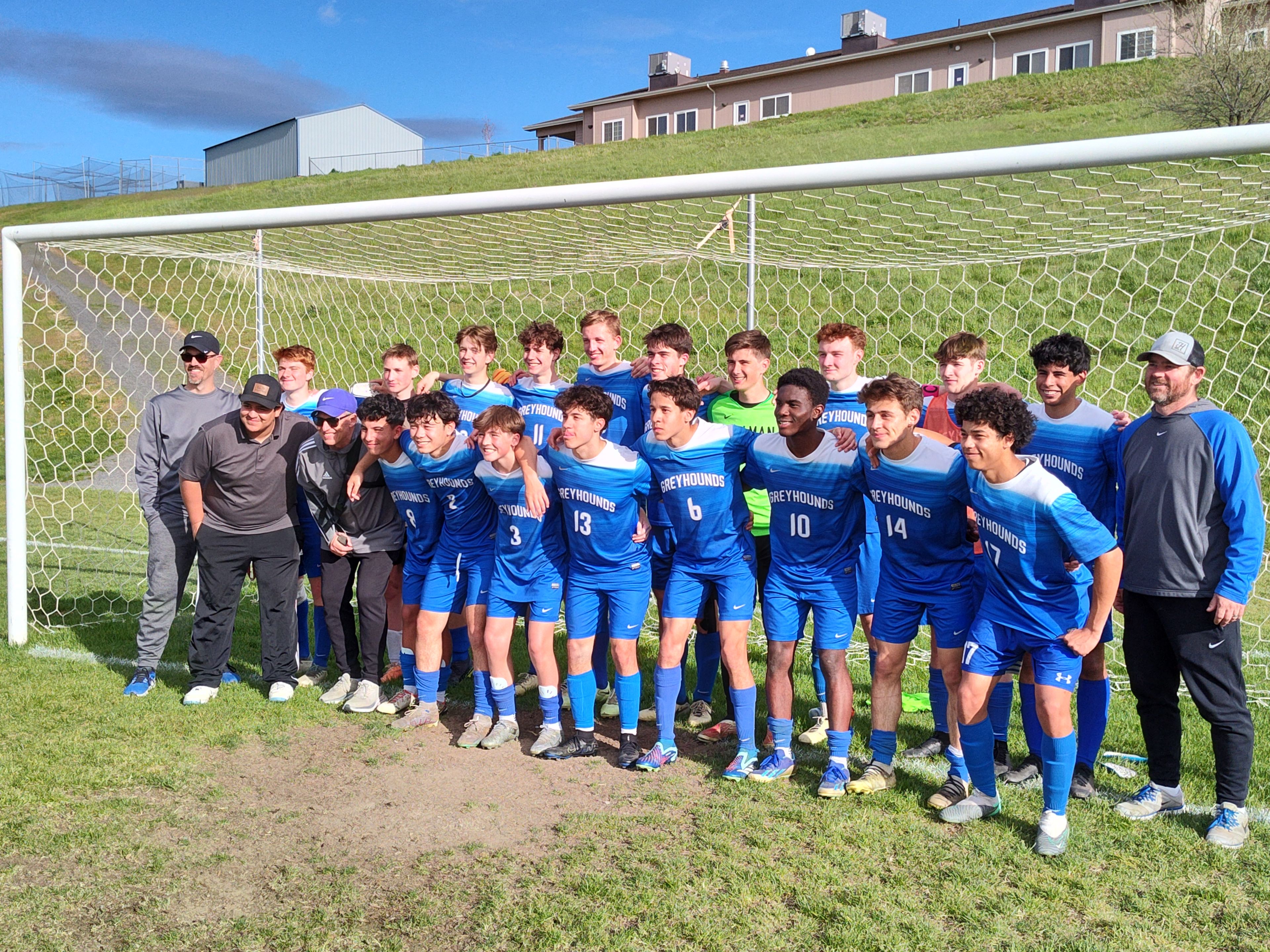 The Pullman boys soccer team poses for photos after defeating West Valley 2-0 to win a Washington 2A district tournament on Wednesday, April 8, 2024, in Pullman.