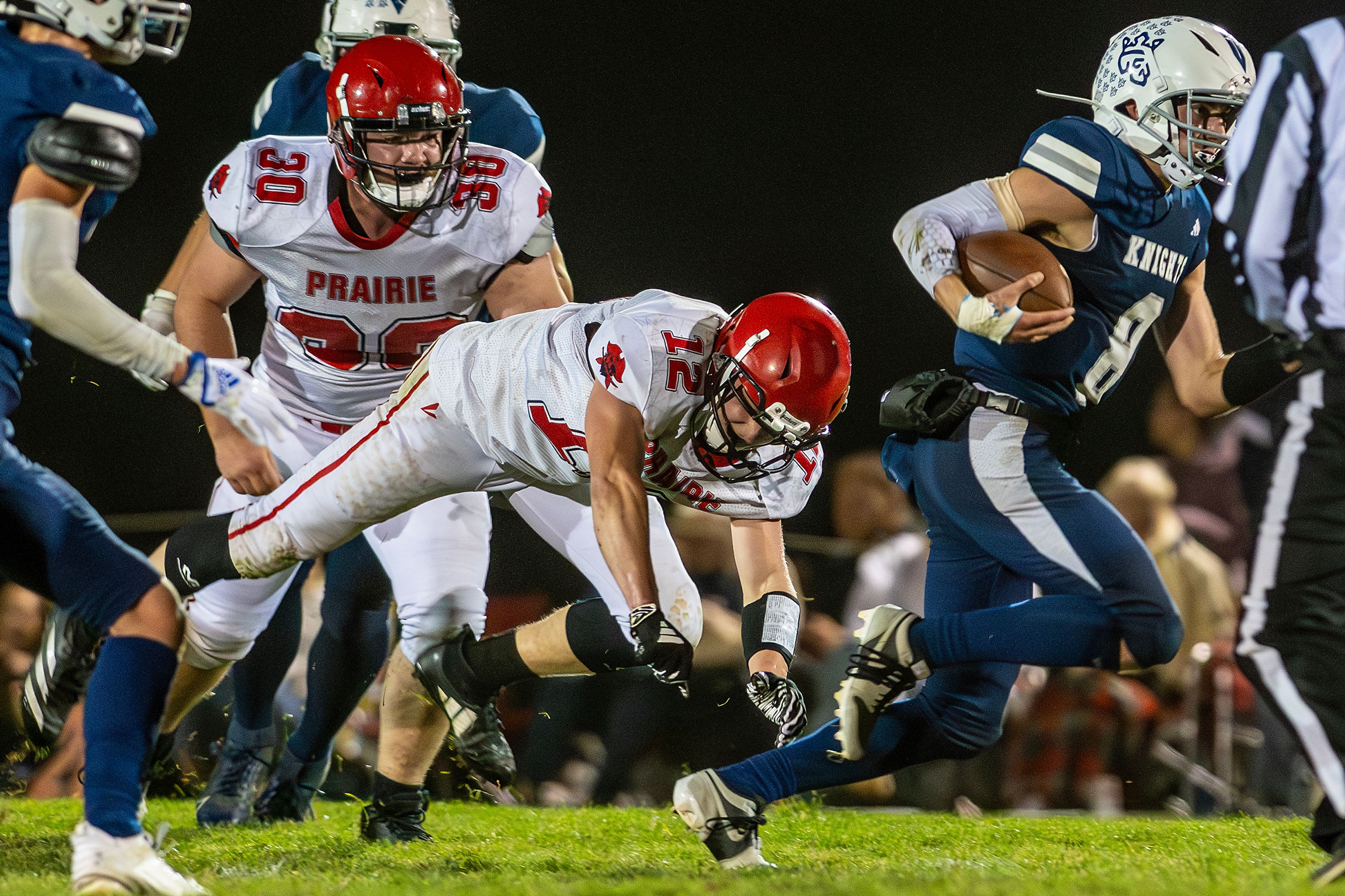 Logos Seamus Wilson runs the ball as Prairie Matt Wemhoff misses the tackle during a conference game Friday in Moscow.,