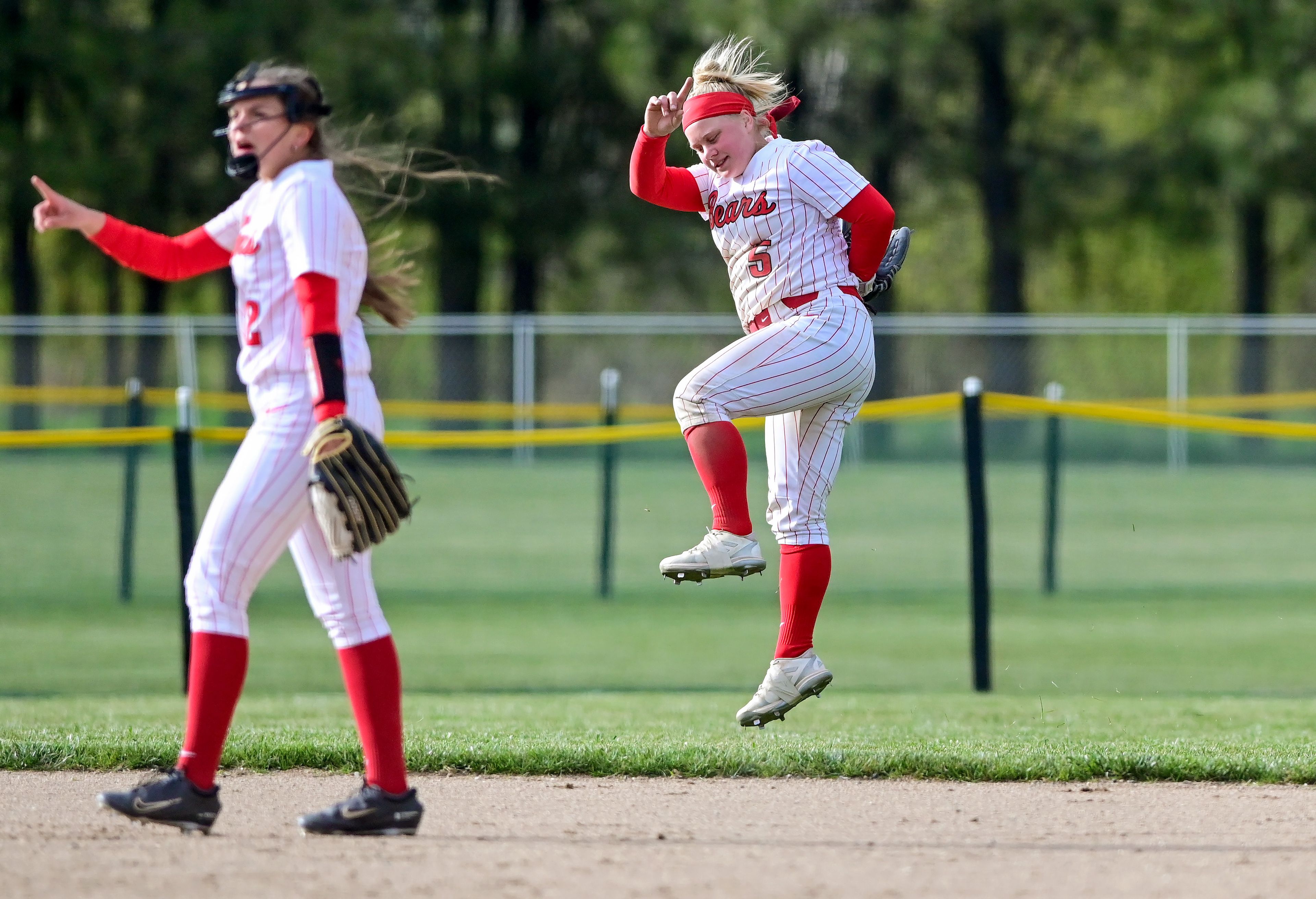 Moscow’s Addie Branen (5) jumps and raises a finger in celebration of an out against Lakeland in Moscow on Tuesday.