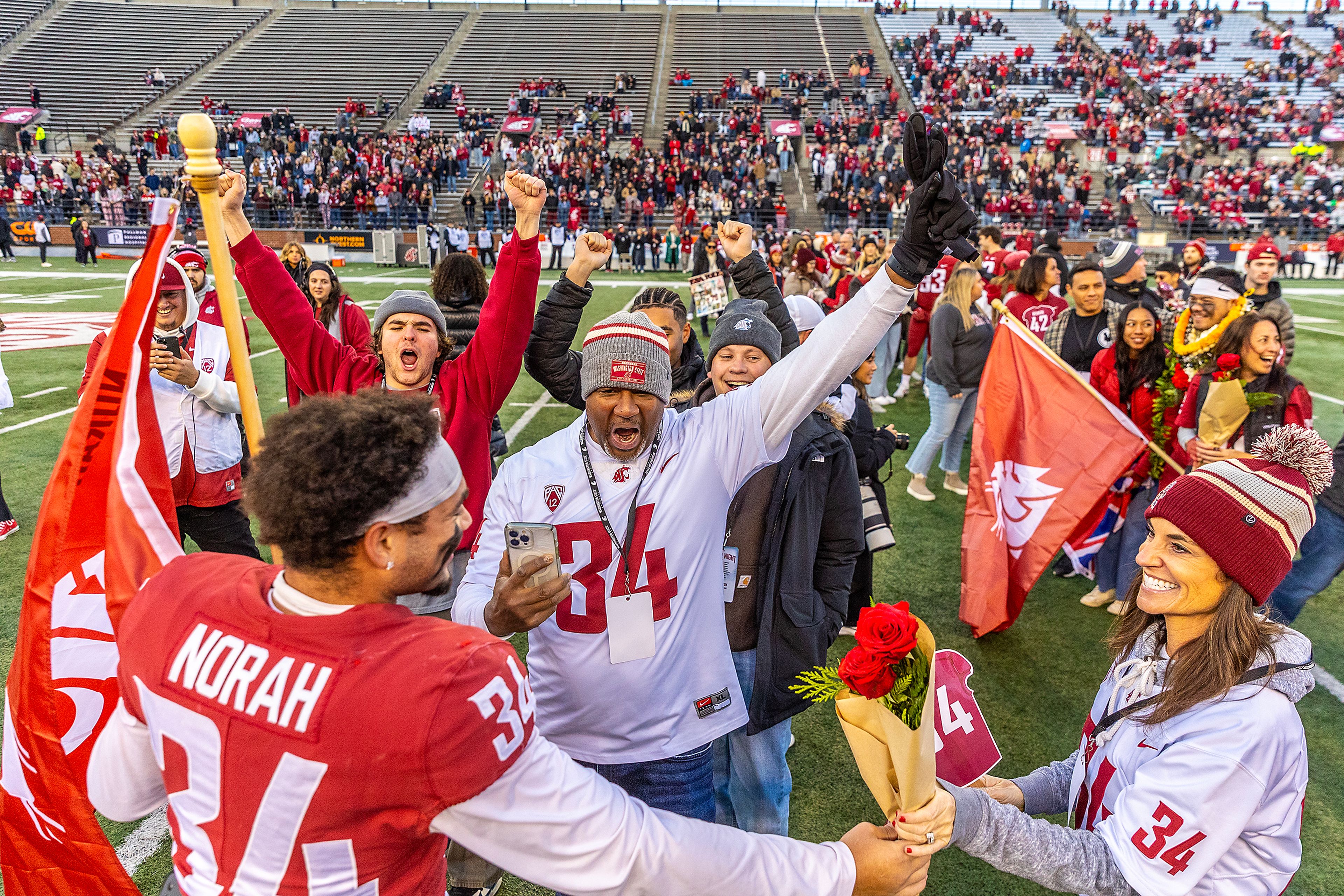 Washington State defensive back Cole Norah greets his family before a college football game on Saturday, at Gesa Field in Pullman.