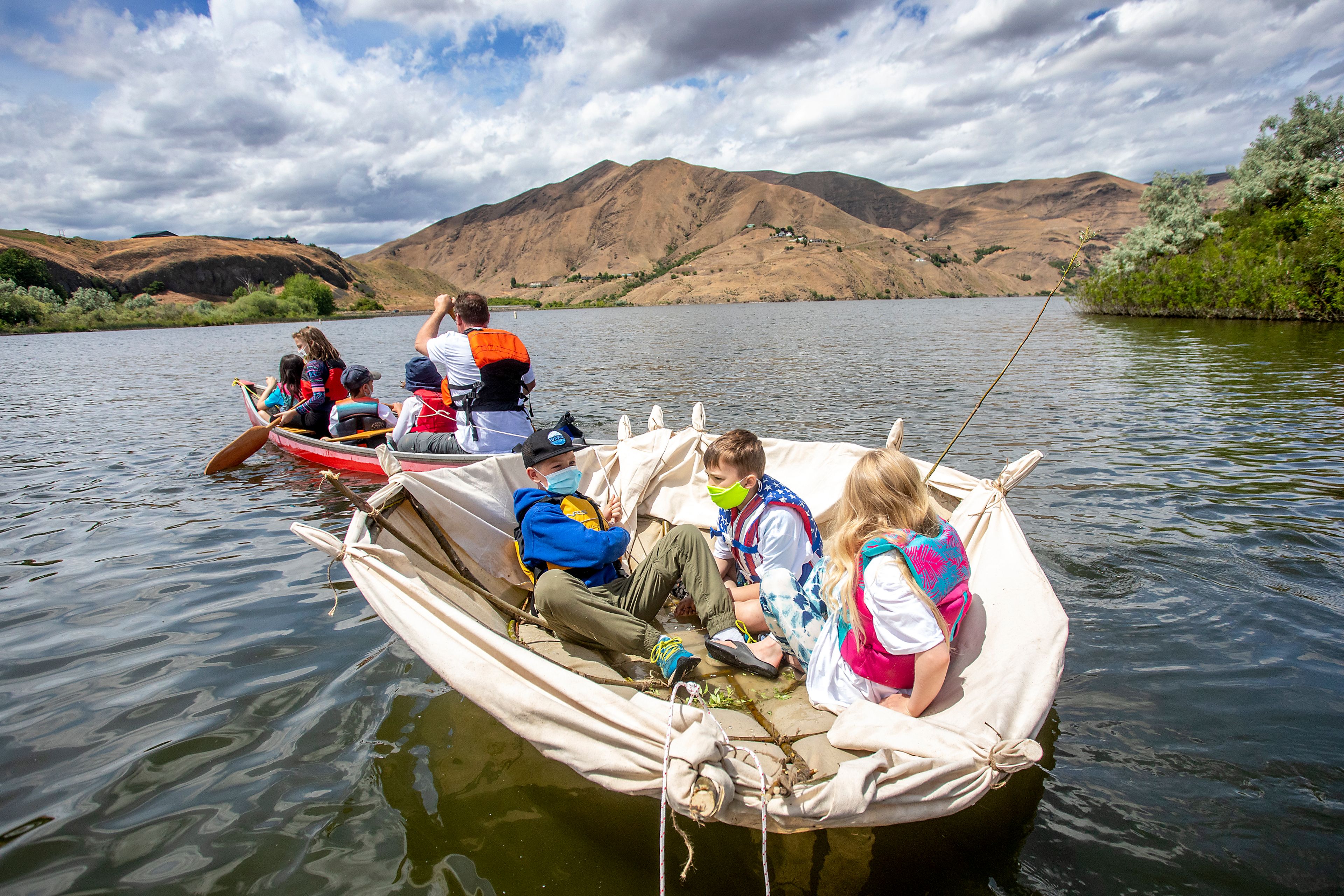 Kids with Palouse Prairie Charter School are pulled out onto the waters of the Snake River in a bull boats they constructed out of canvass and willow branches on Monday. Aside from letting in a little water, the boat, and two others, successfully floated through the water. The boats were originally used for children, women and the elderly to escape quickly across rivers from pursuing American troops. “The future of our people were in those bull boats,” Garry Dorr said.