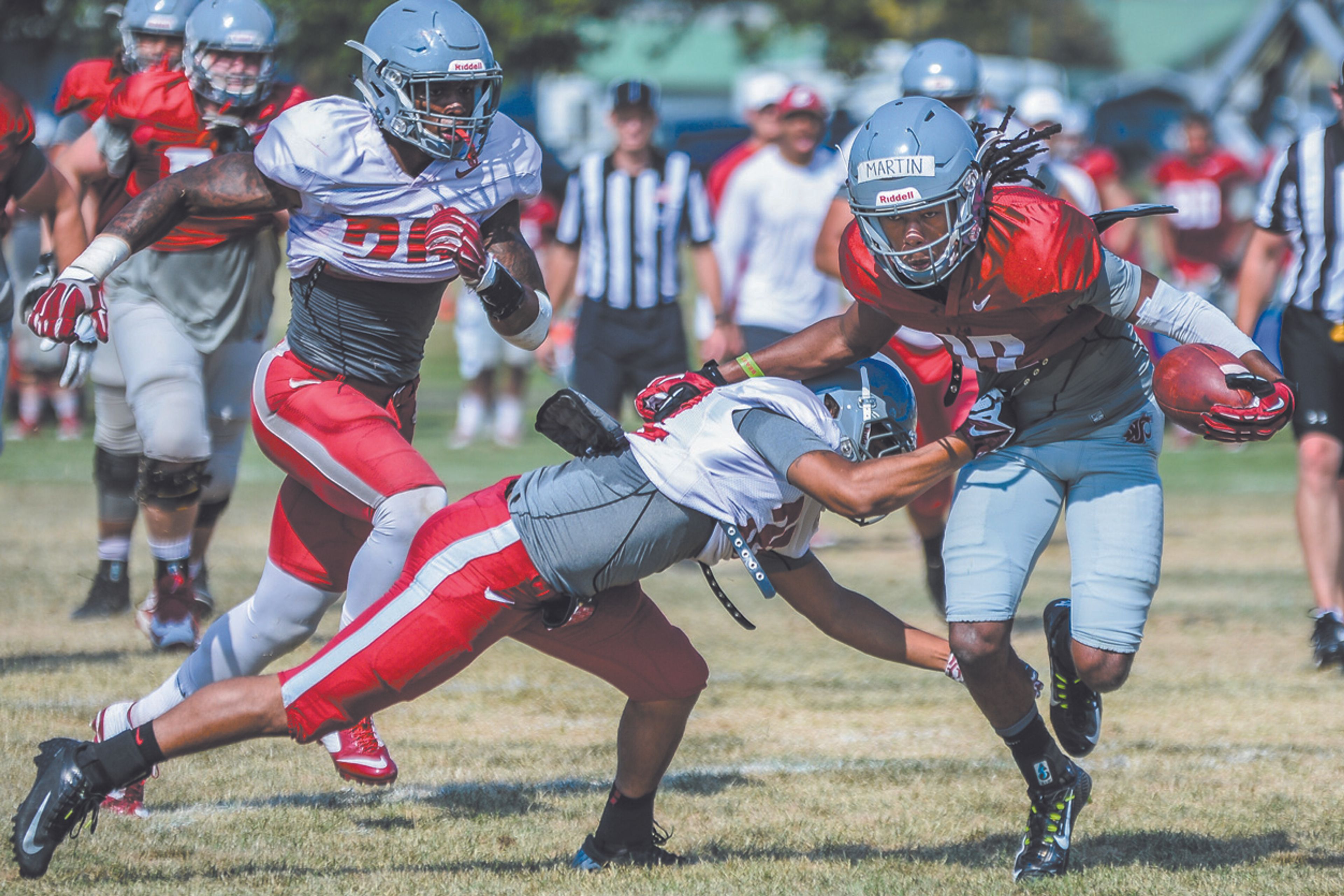 Washington State receiver Tavares Martin Jr. heads down the field after making a catch during Sunday’s scrimmage at Sacajawea Junior High School in Lewiston.