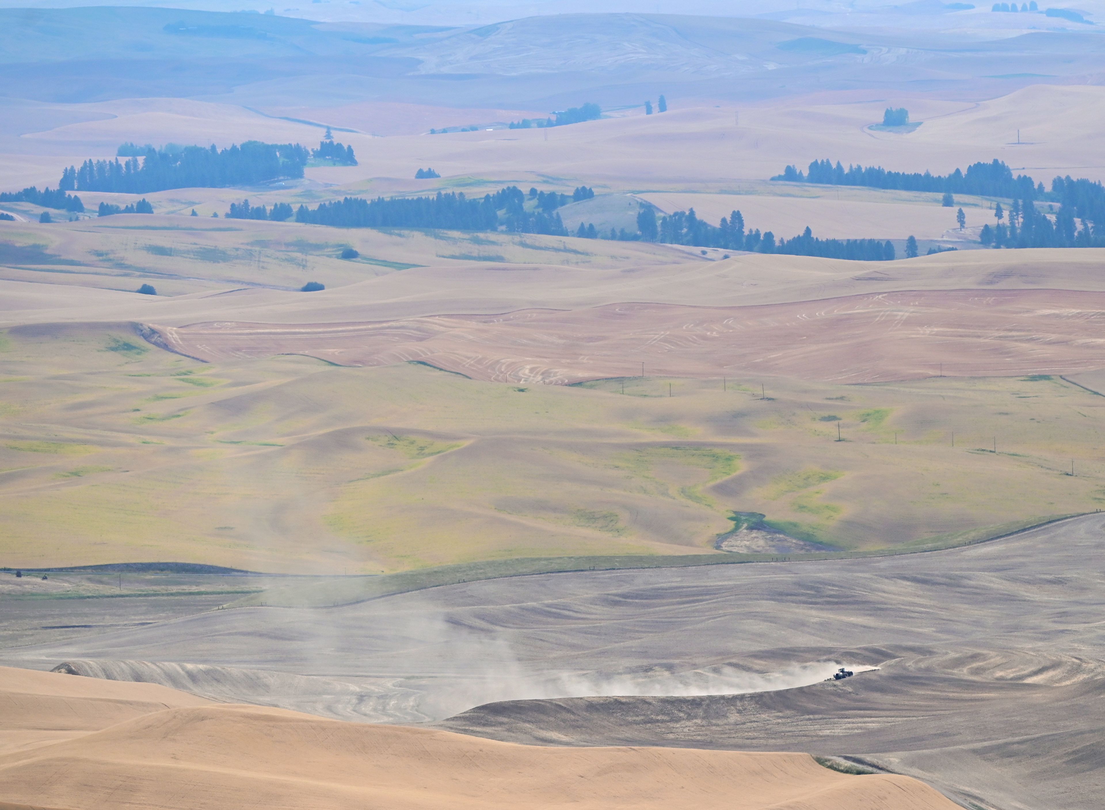 Dust rises as a field is tilled after harvesting on Monday from a viewpoint on Steptoe Butte.