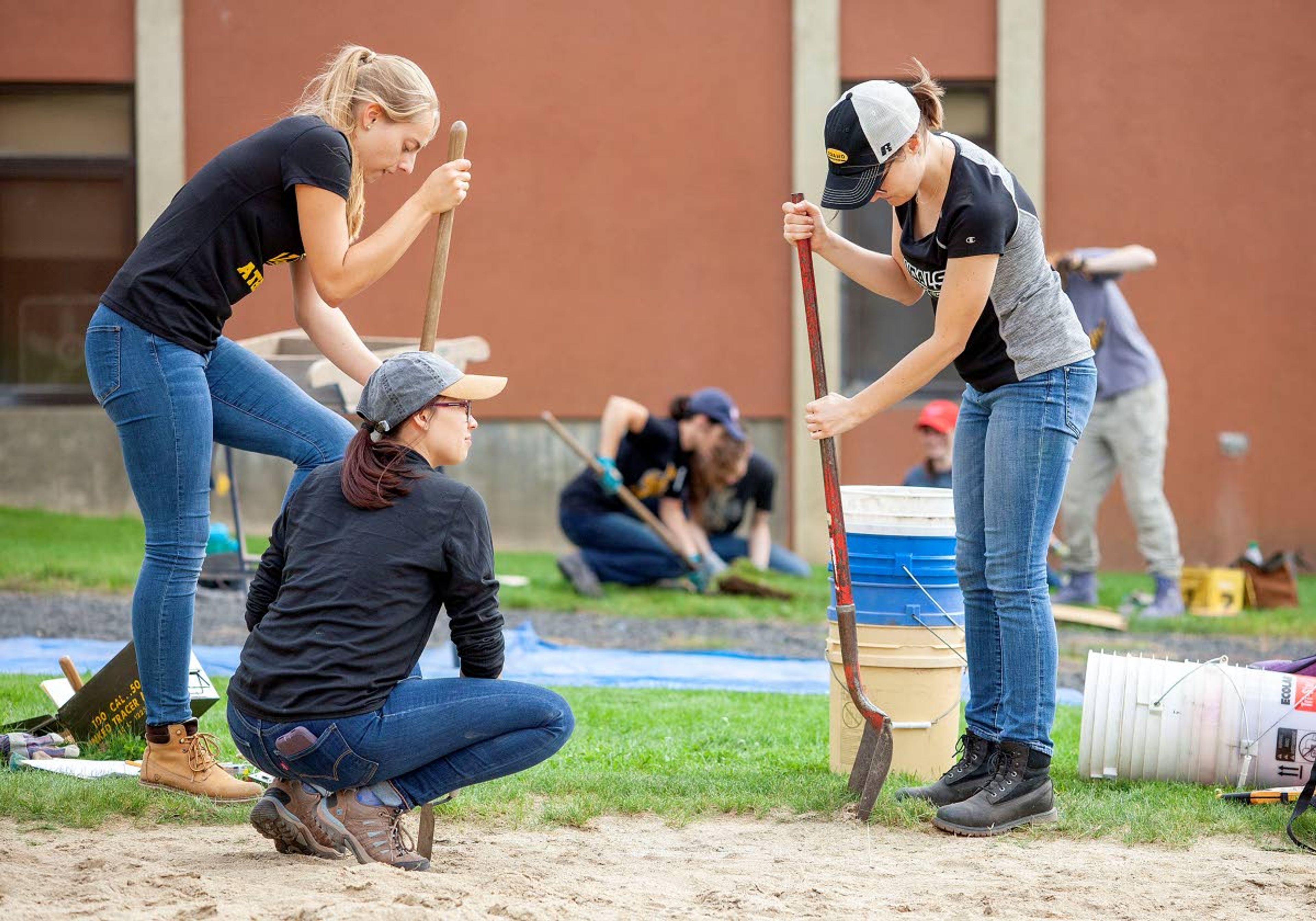 Geoff Crimmins/Daily NewsLeft to right: University of Idaho anthropology students Henrike Fiedler, Willow Elsom and Tessie Burningham begin to excavate a unit at an archaeological site Friday outside Moscow High School.