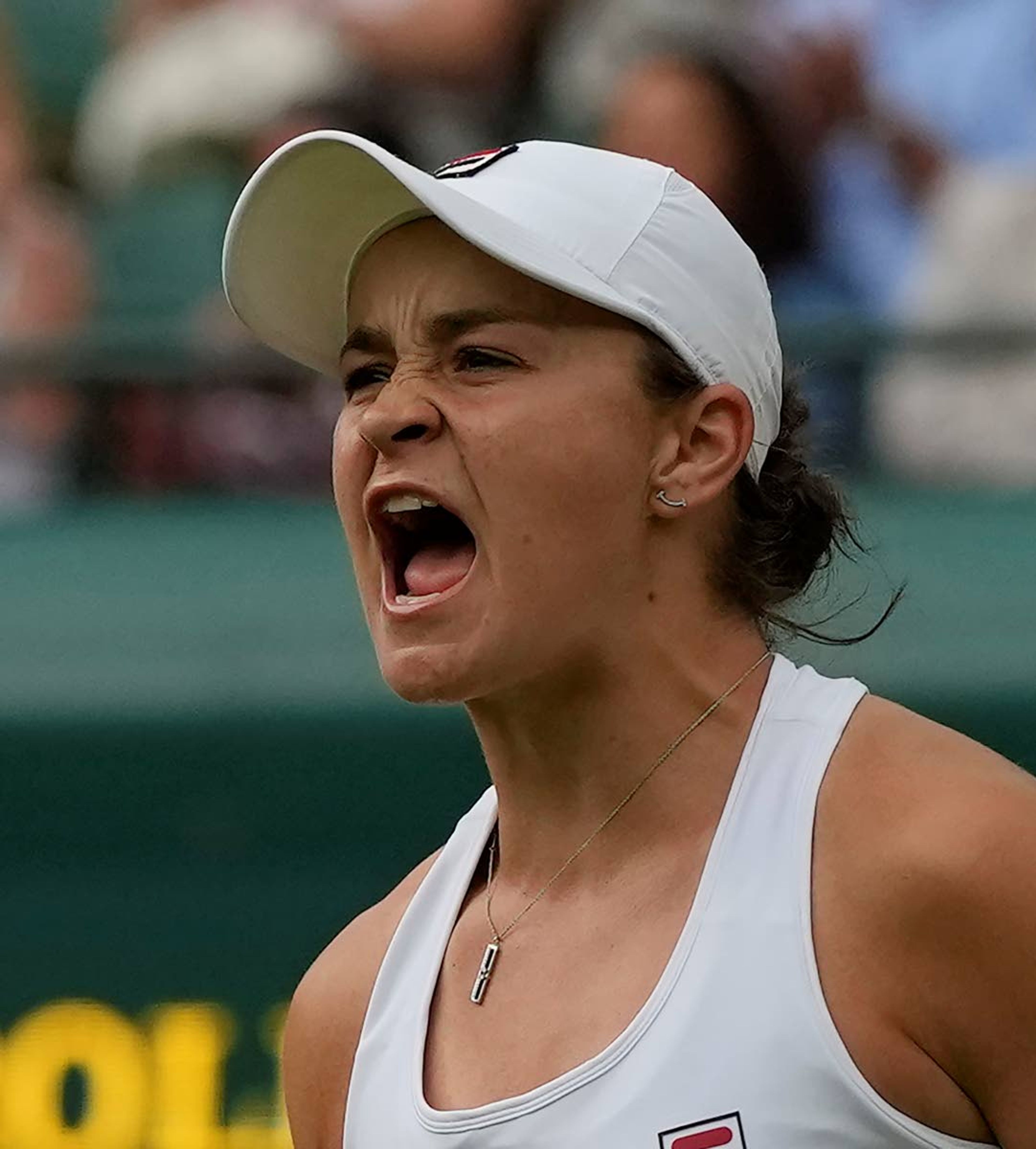 Australia's Ashleigh Barty celebrates after winning the women's singles fourth round match against Czech Republic's Barbora Krejcikova on day seven of the Wimbledon Tennis Championships in London, Monday, July 5, 2021. (AP Photo/Alastair Grant)