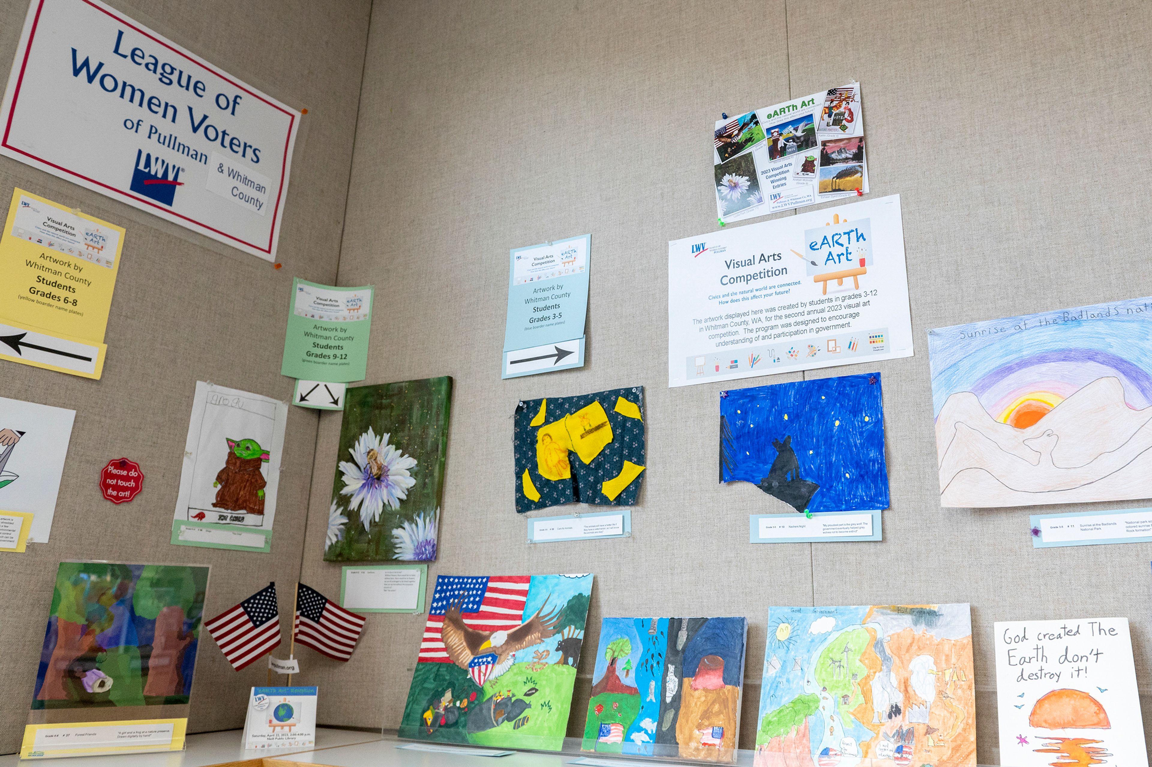 Contest winners from the League of Women Voters of Pullman and Whitman County’s second annual Visual Arts Competition are displayed on bookshelves at Neill Public Library in Pullman. The theme of the competition this year was about Earth and how the natural world connects with civics.