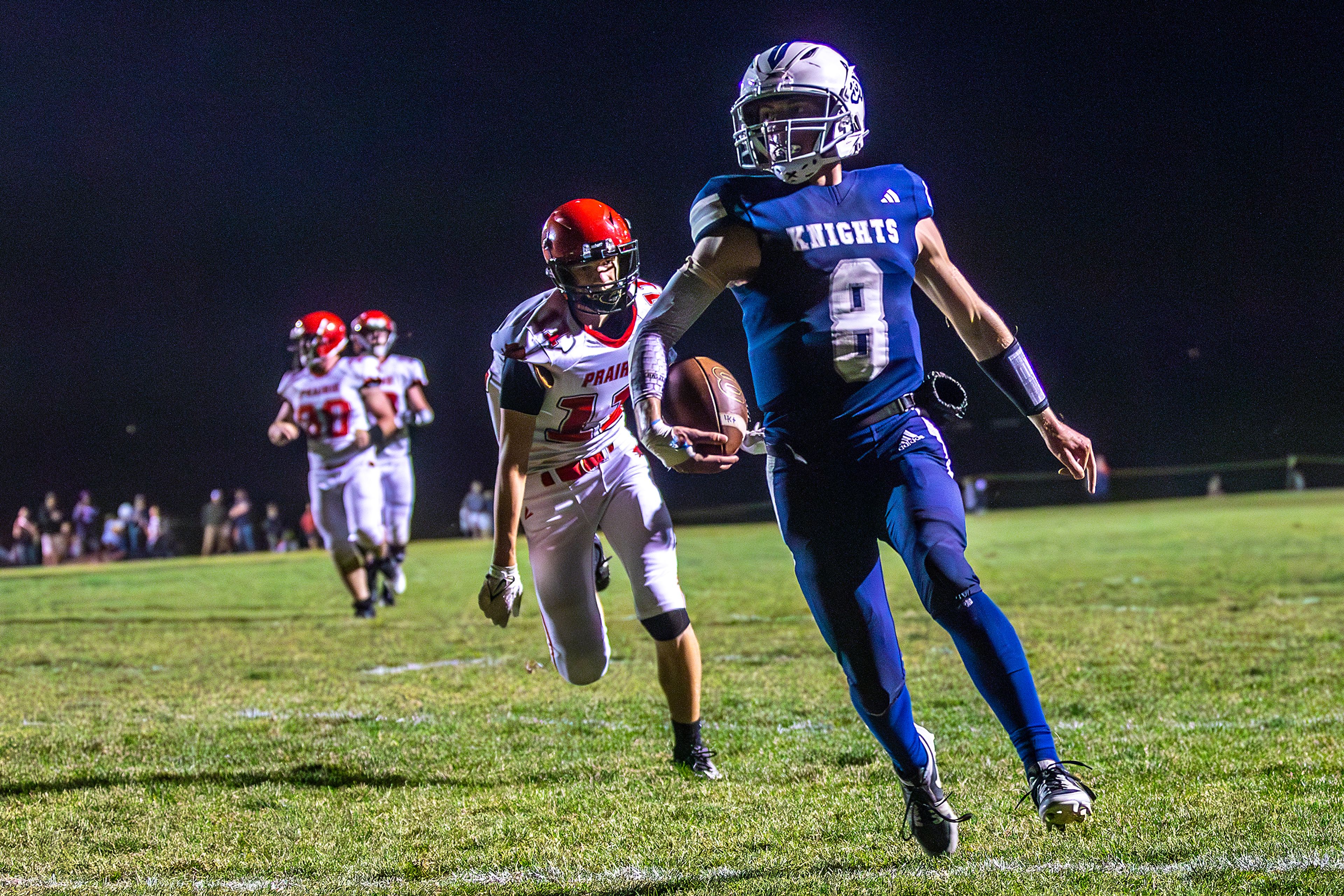 Logos Seamus Wilson runs the ball in for a touchdown against Prairie during a conference game Friday in Moscow.,