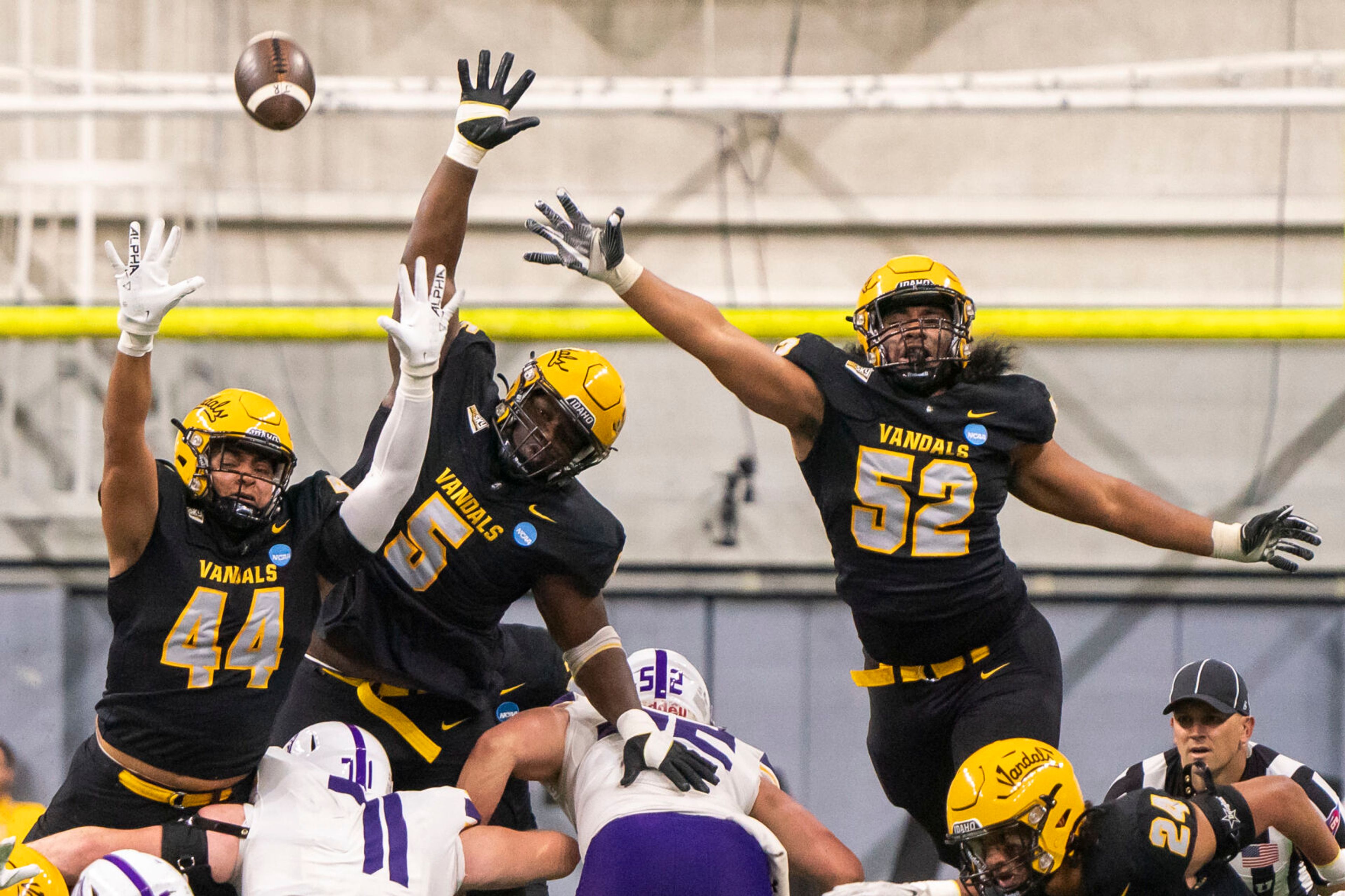 Vandals defensive lineman Keyshawn James-Newby (44), linebacker Jahkari Larmond (5) and defensive lineman Dallas Afalava (52) attempt to block a field goal during a game against Albany the FCS quarterfinals on Dec. 9 at the P1FCU Kibbie Dome in Moscow.