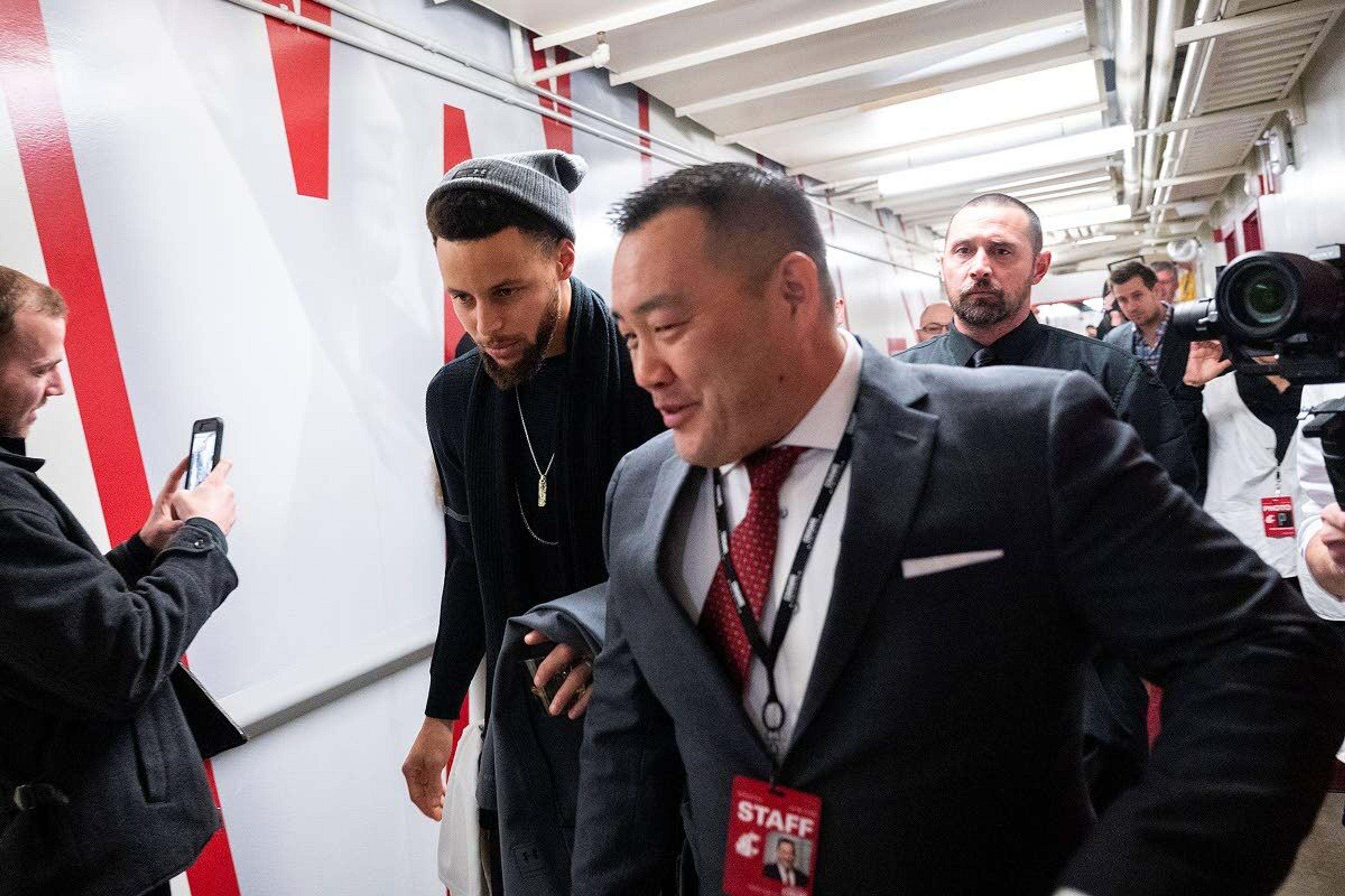 Washington State athletic director Pat Chun escorts All-NBA guard Steph Curry to his courtside seat before the start of a Jan. 18, 2020, Cougar men’s basketball game against Oregon State. Chun was given a new, five-year contract that begins July 1.