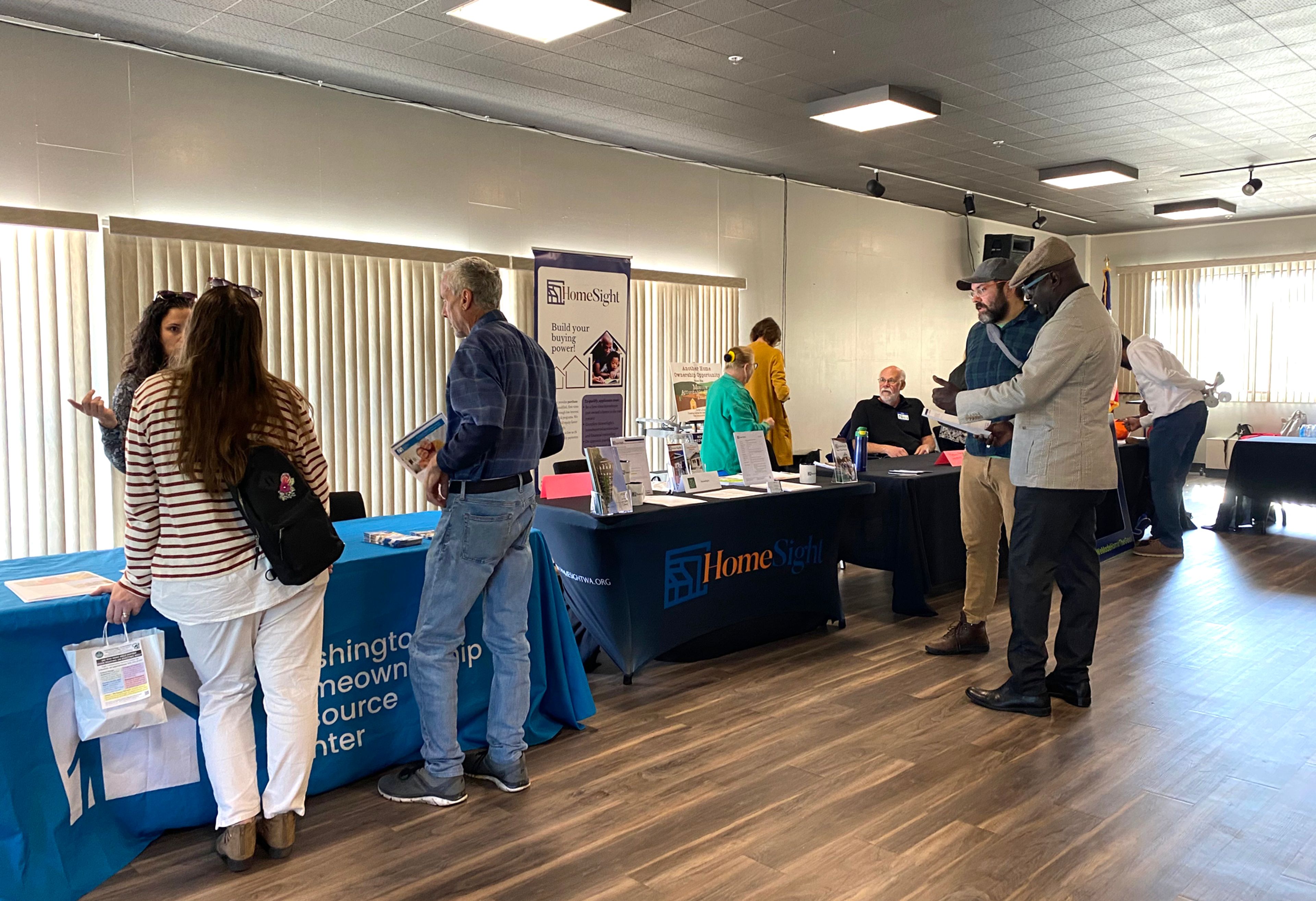 Attendees check out the booths during the Homeownership Resource Fair on Saturday at the Gladish View Room in Pullman.