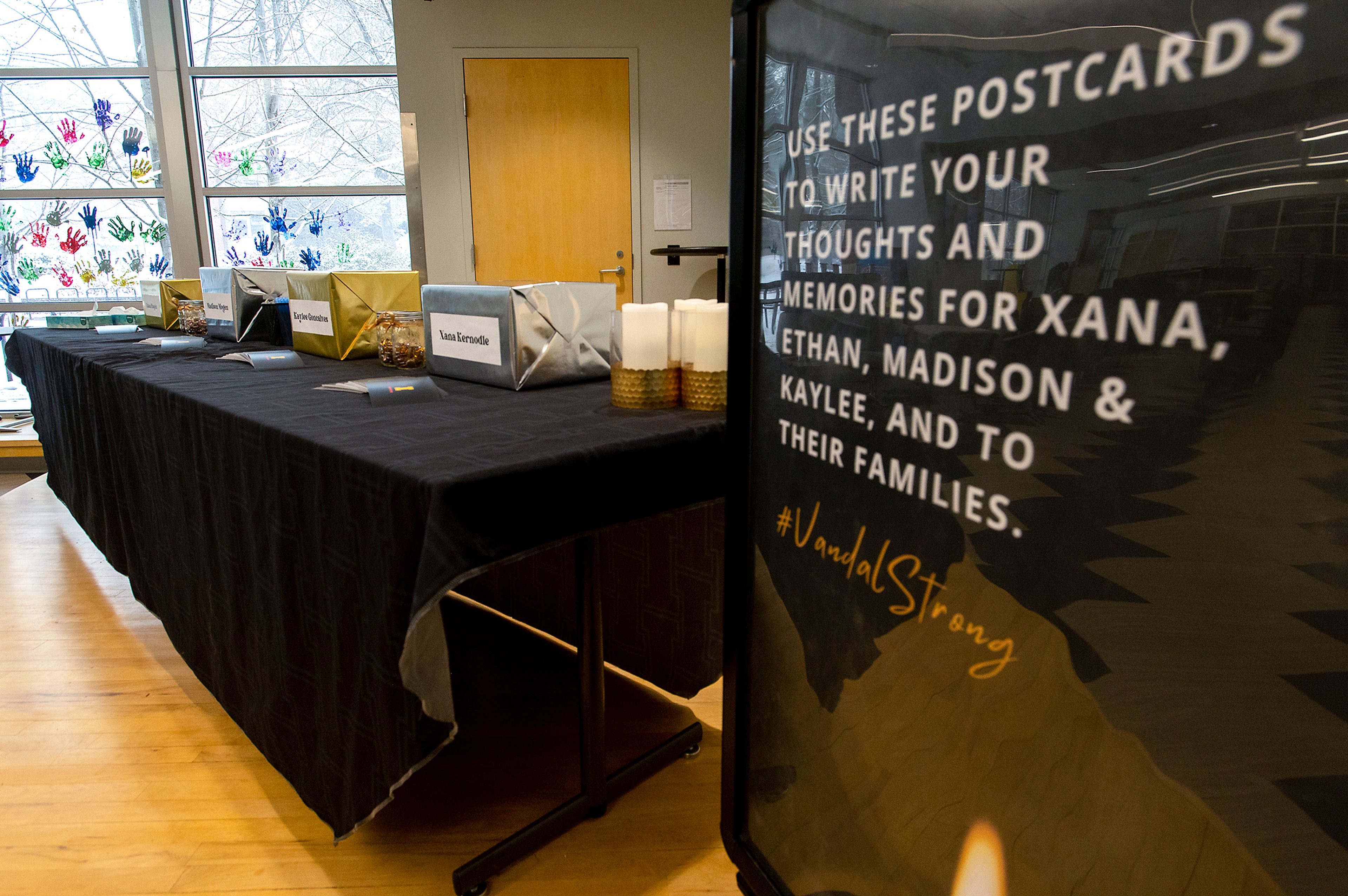 Postcards and boxes designated for the four student victims of an off-campus homicide are displayed for anyone who wishes to share their thoughts and memories in the Idaho Student Union Building as University of Idaho classes resume on the Moscow campus.