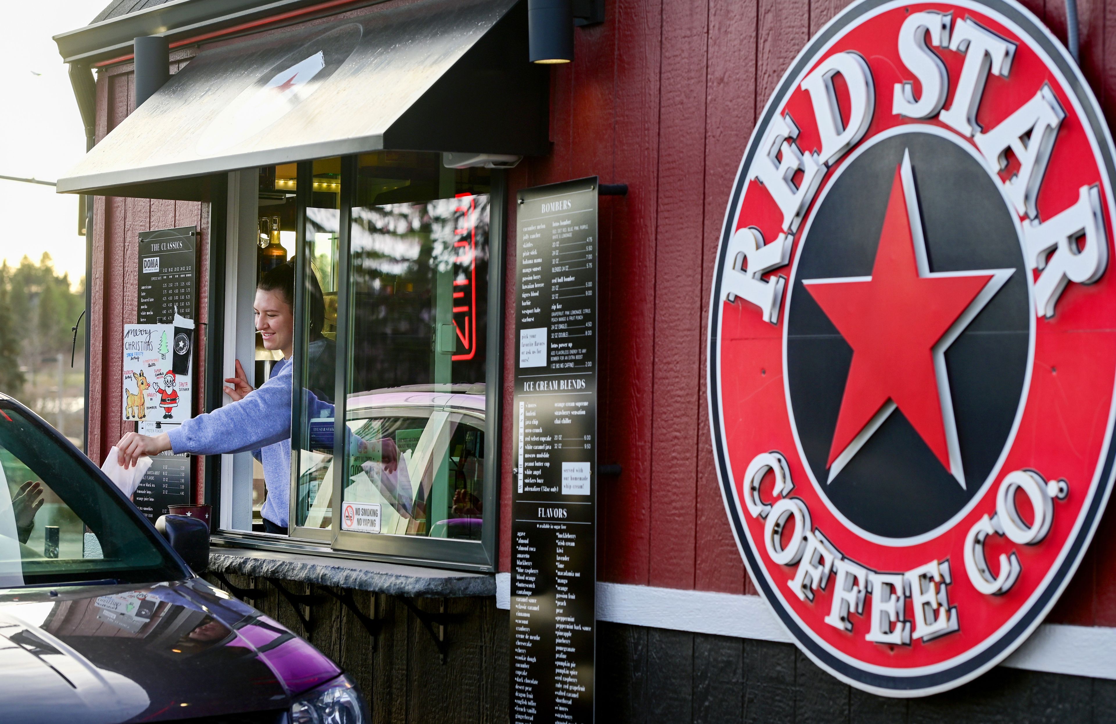 Barista Peyton Watson passes drinks and food to customers stopping by Red Star Coffee Company along Pullman Road in Moscow in this 2023 file photo. The University of Idaho gained approval from the Idaho State Board of Education on Wednesday to allow another Red Star Coffee Company location to open on campus in Monday.