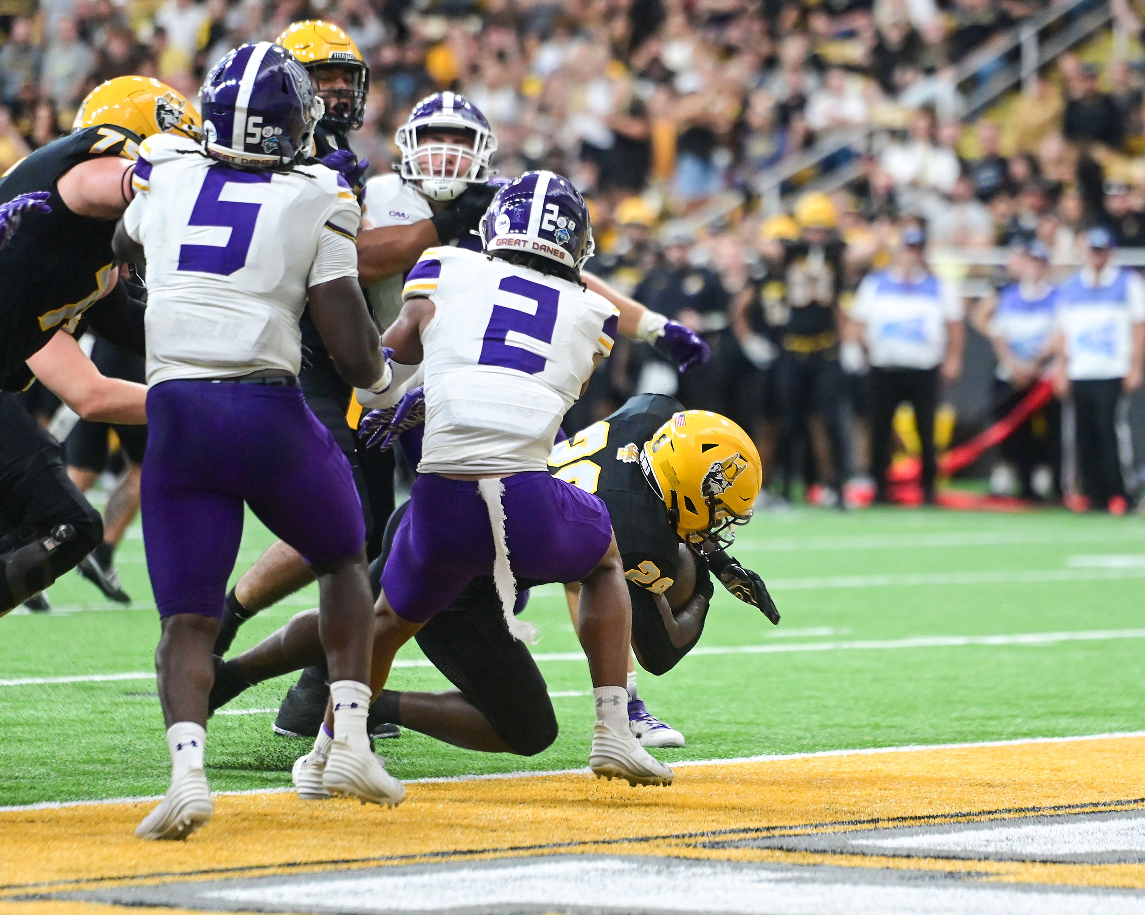 Idaho Vandals running back Nate Thomas (28) dives into the end zone for a touchdown against the Albany Great Danes Saturday at the P1FCU Kibbie Dome in Moscow.,