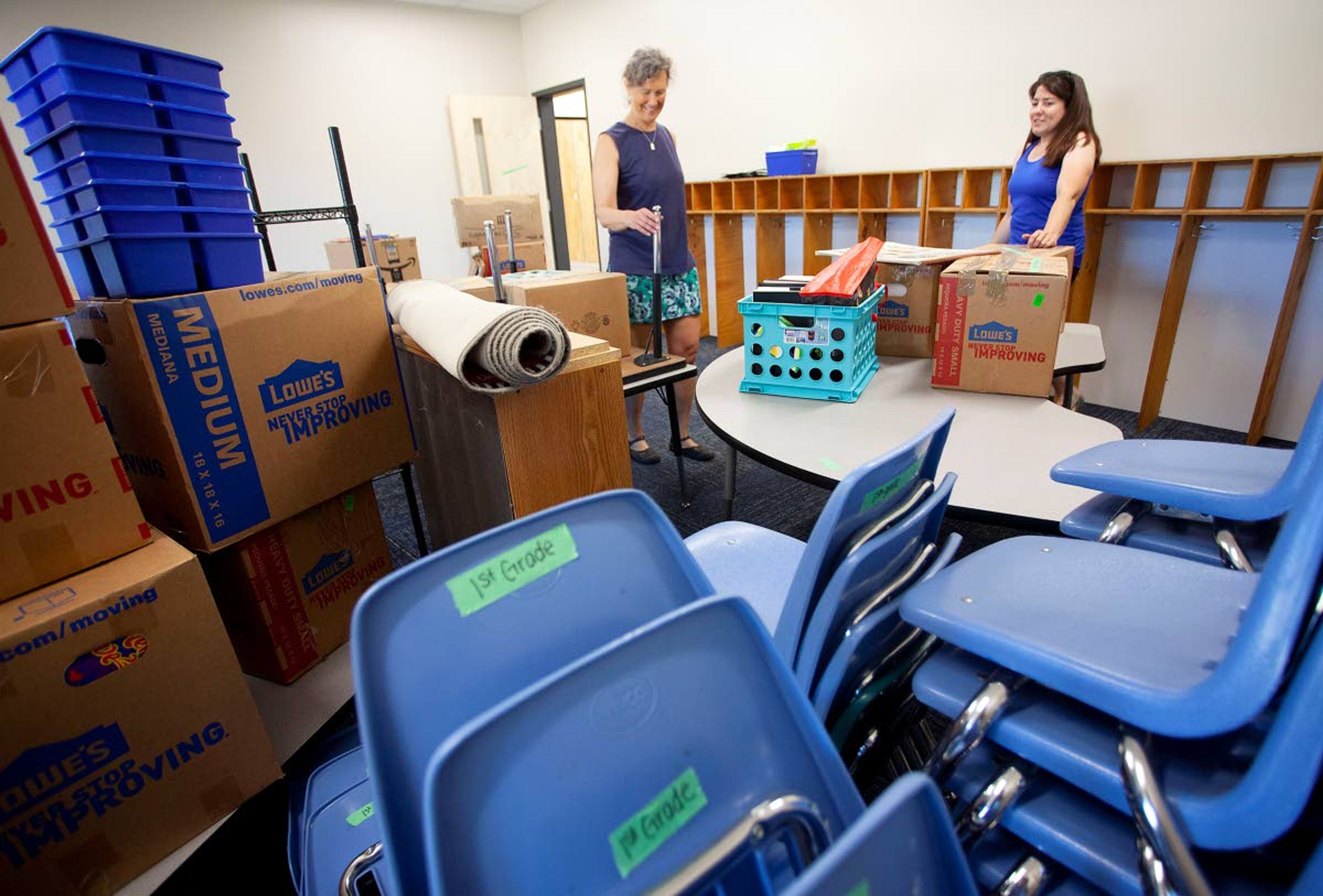 Teachers Andrika Kuhle, left, and Alissa Klemencic organize Klemencic's first-grade classroom in the new Palouse Prairie Charter School building Thursday in Moscow.