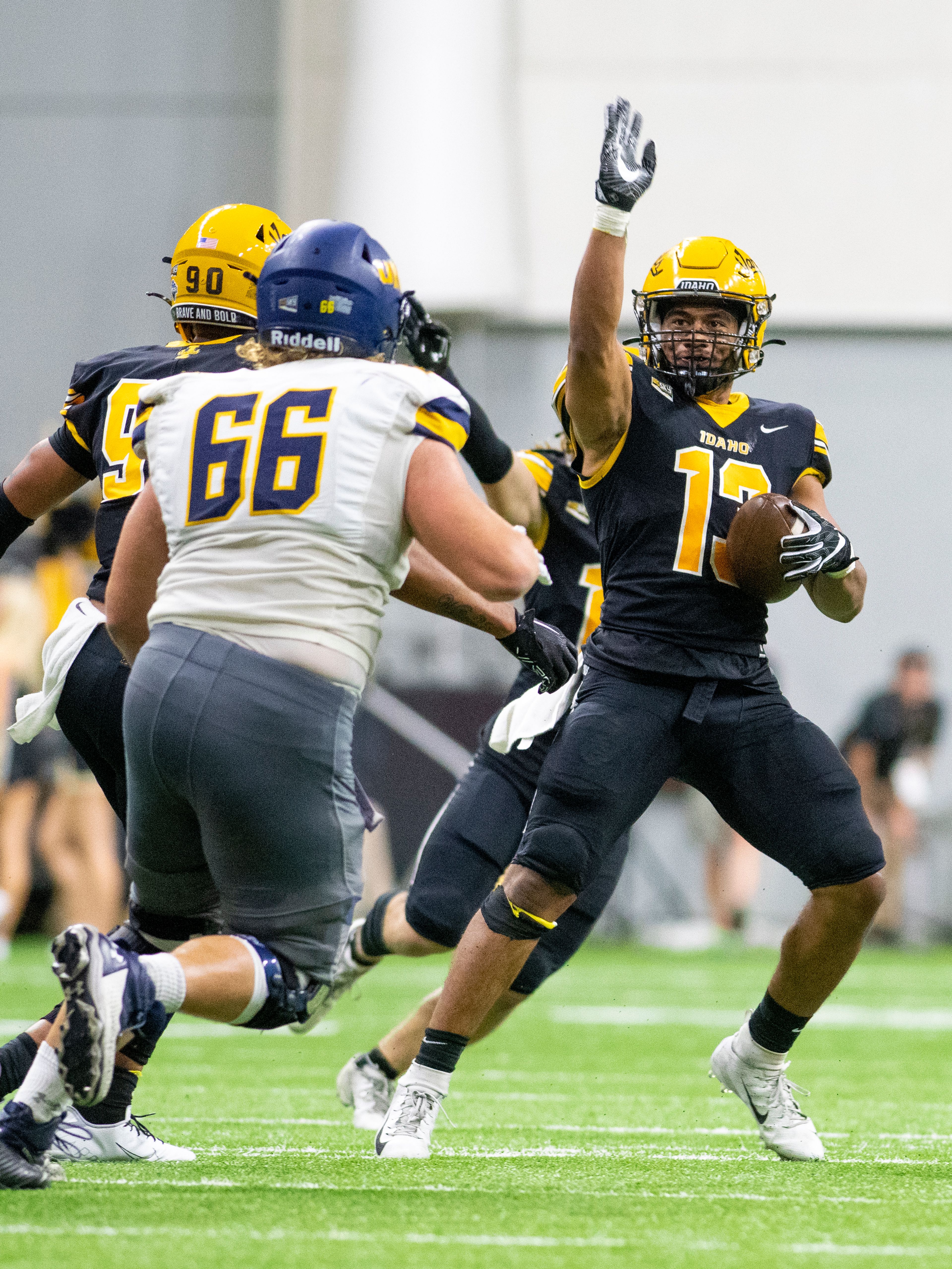 Vandals linebacker Paul Moala, right, celebrates after intercepting a pass during the third quarter of a Big Sky Conference football game against the Northern Colorado Bears at the Kibbie Dome in Moscow. Idaho scored 24 unanswered points to start the second half and dispatched the Bears 55-35.