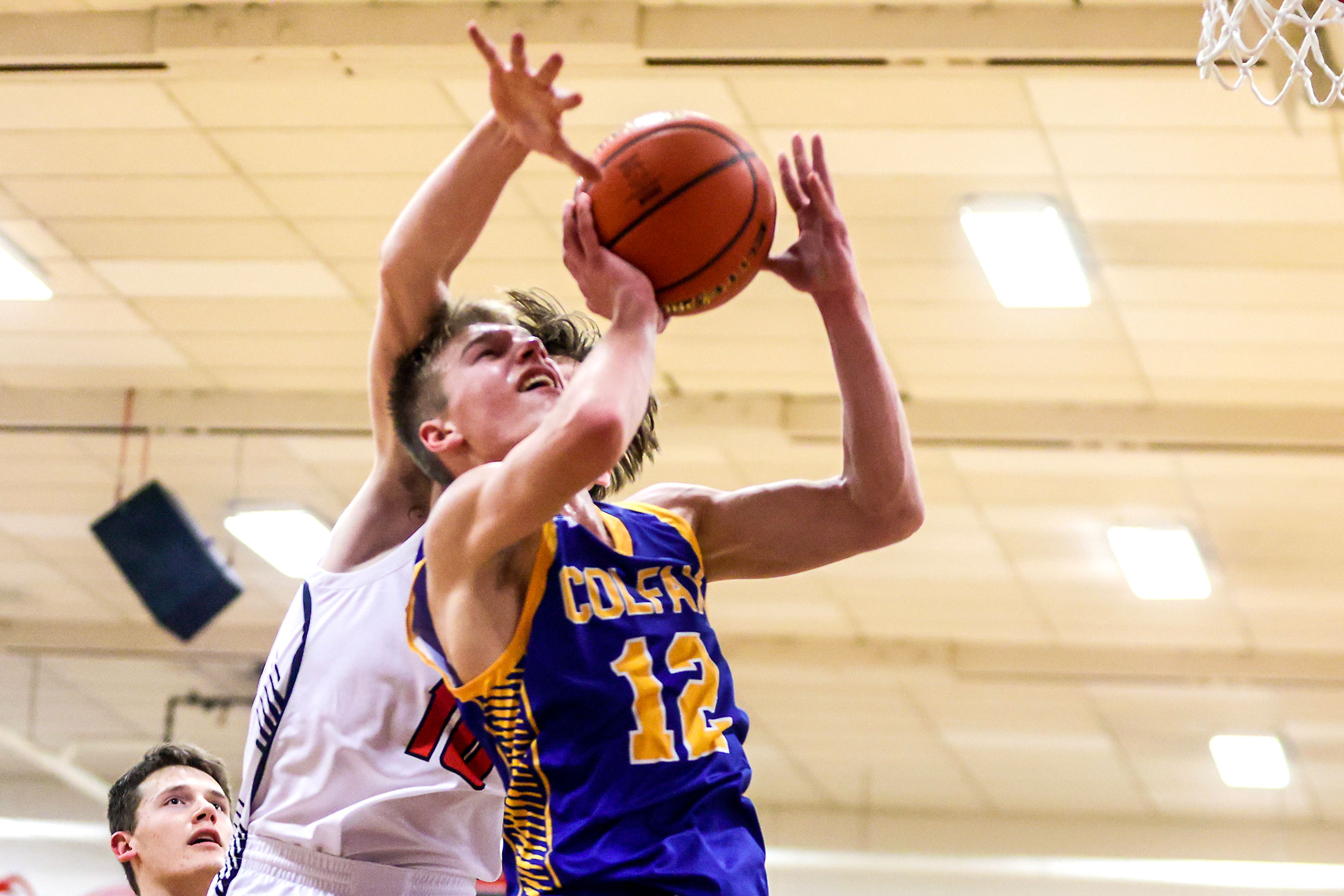 Colfax Seth Lustig leaps towards the basket for a shot against Clarkston in a quarter of a nonleague game Thursday at Clarkston.