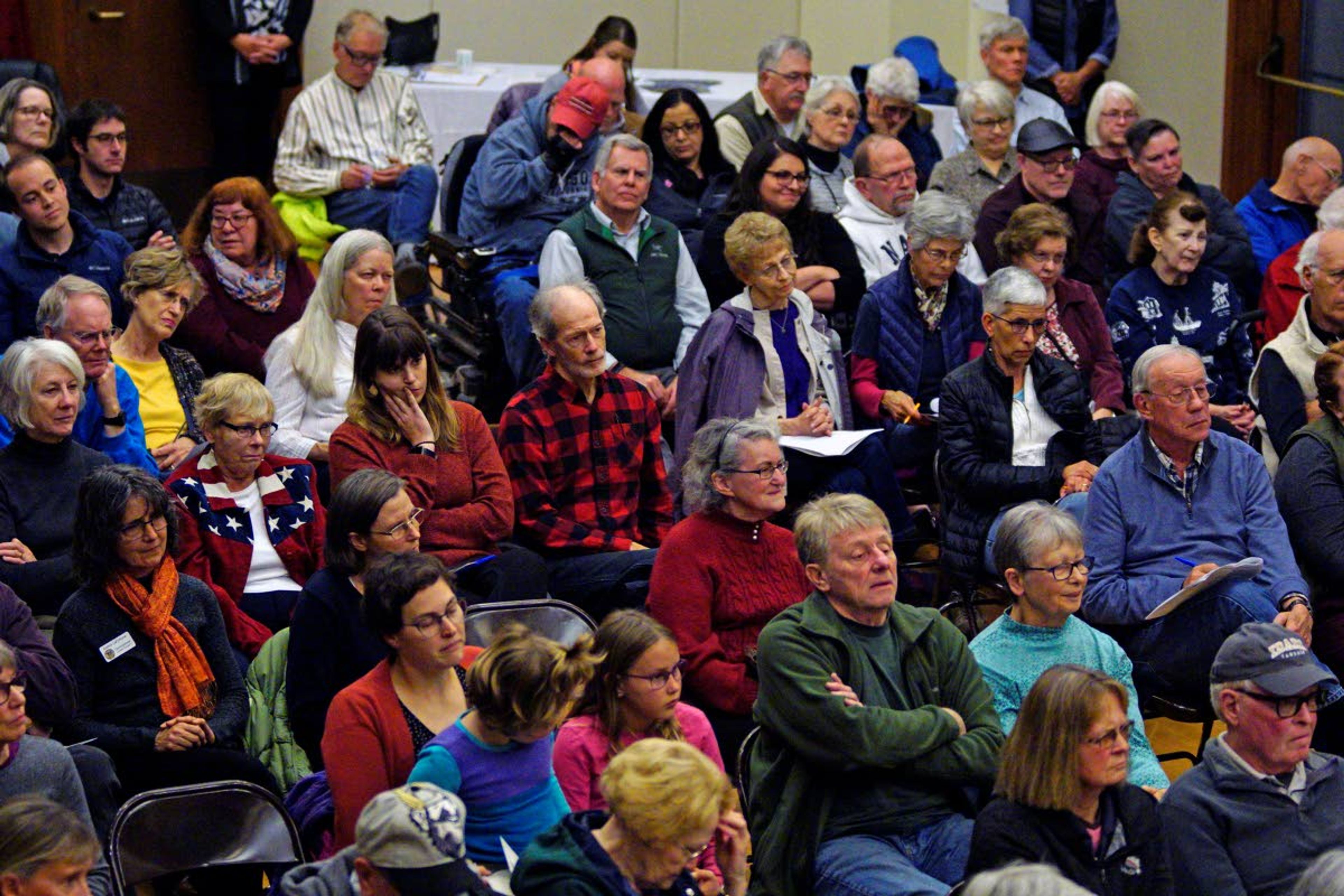 Kai Eiselein/Daily NewsPeople listen to a Moscow City Council candidate’s response to a question.