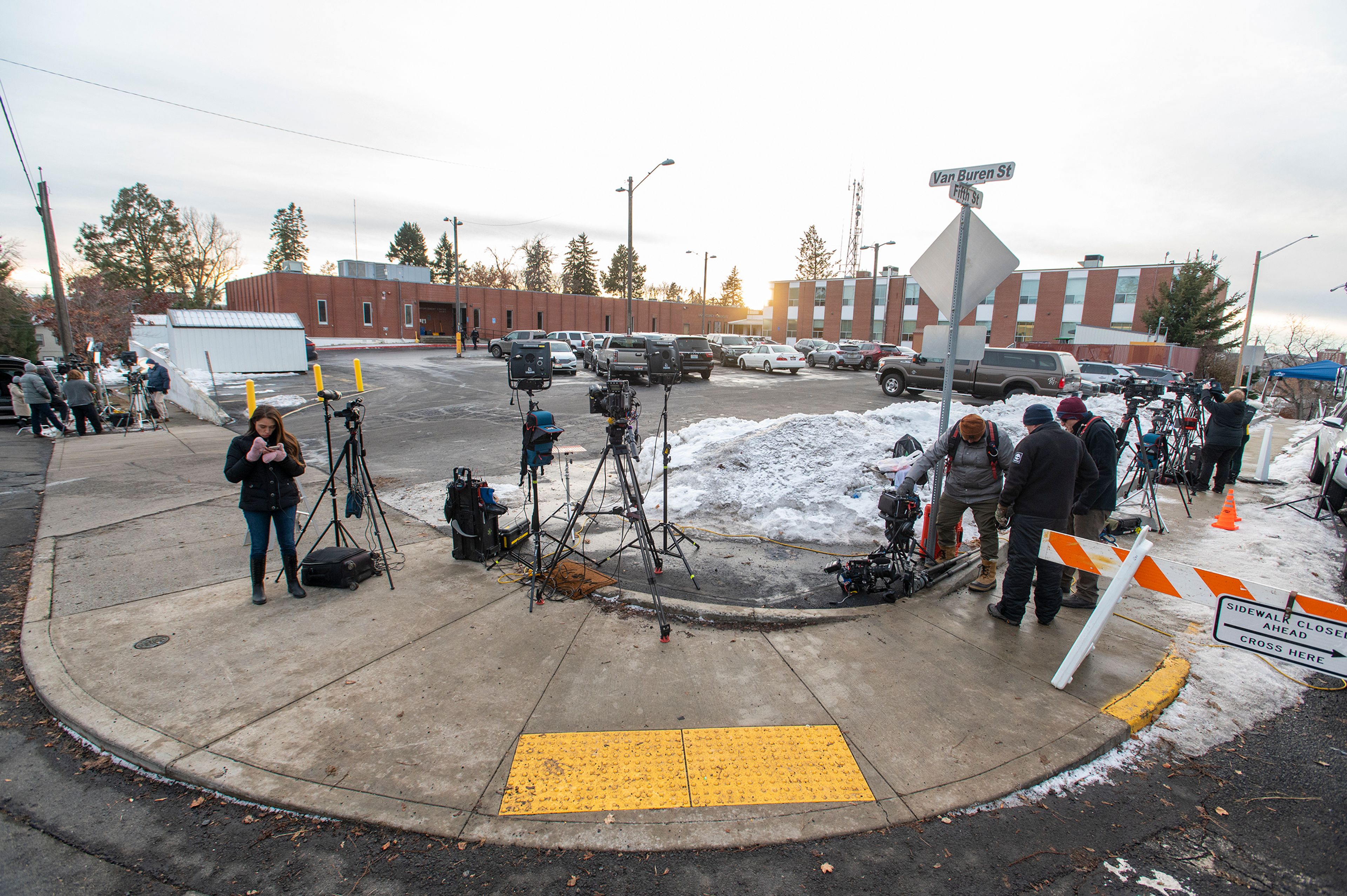 Media members setup cameras outside of the Latah County Jail as they wait for the arrival of Bryan Kohberger in Moscow on Wednesday. Kohberger is a suspect in a quadruple homicide case involving four University of Idaho students from Nov. 13.