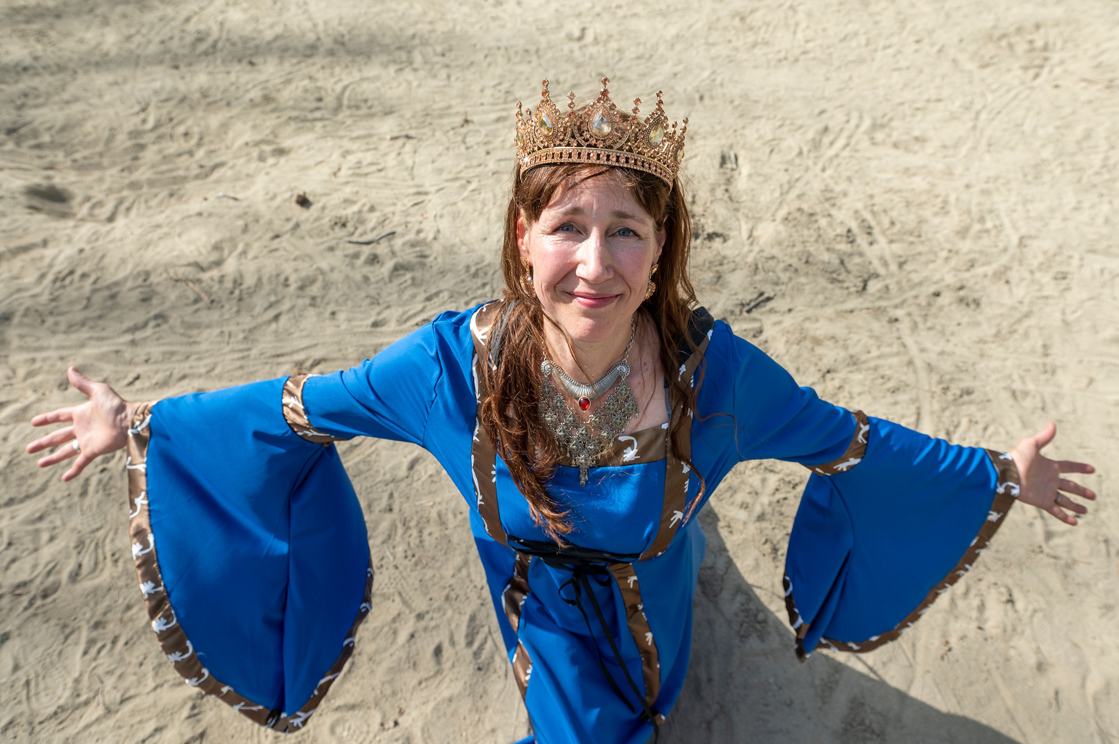 Queen Leeanne Noble, former princess of the sandbox, poses for a portrait Tuesday in the sandbox at East City Park in Moscow. “Life is too important to be taken seriously,” Noble said.