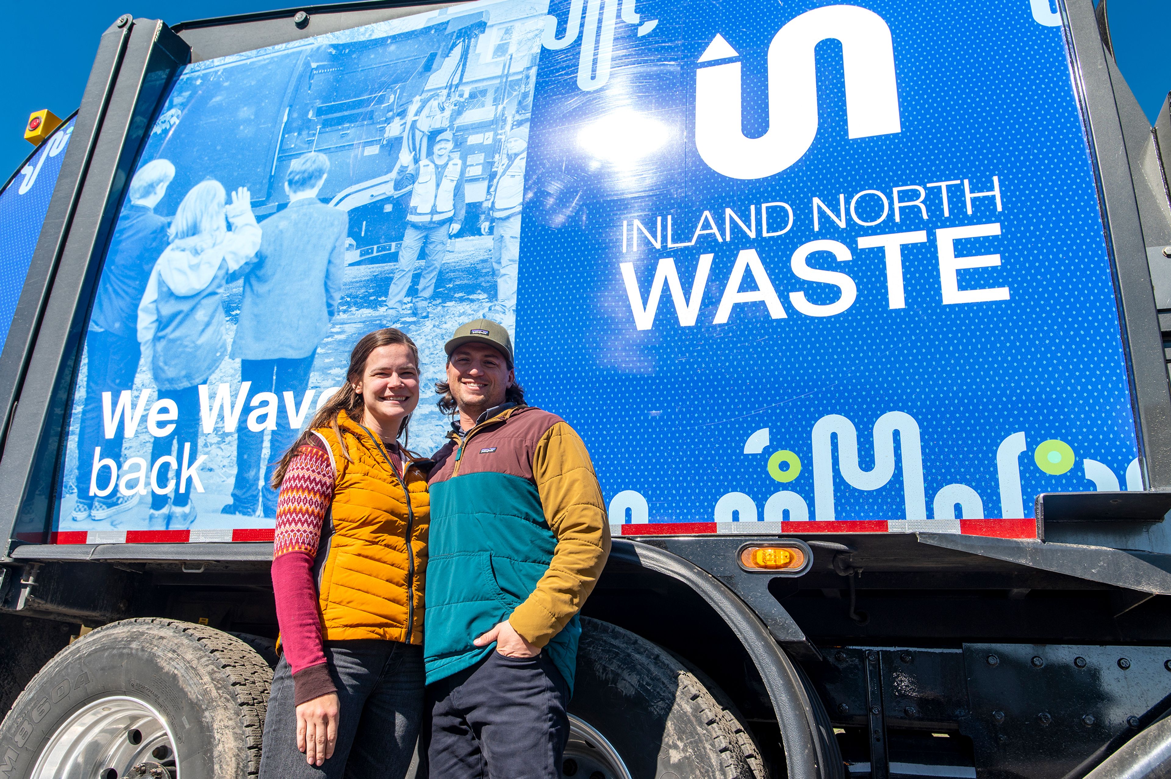 Chief Administrative Officer Stevie Steely-Johnson and her husband, CEO Brandon Steely-Johnson, pose for a portrait in front of the fleets first Inland North Waste wrapped truck in Moscow. The company recently changed its name from Latah Sanitation.