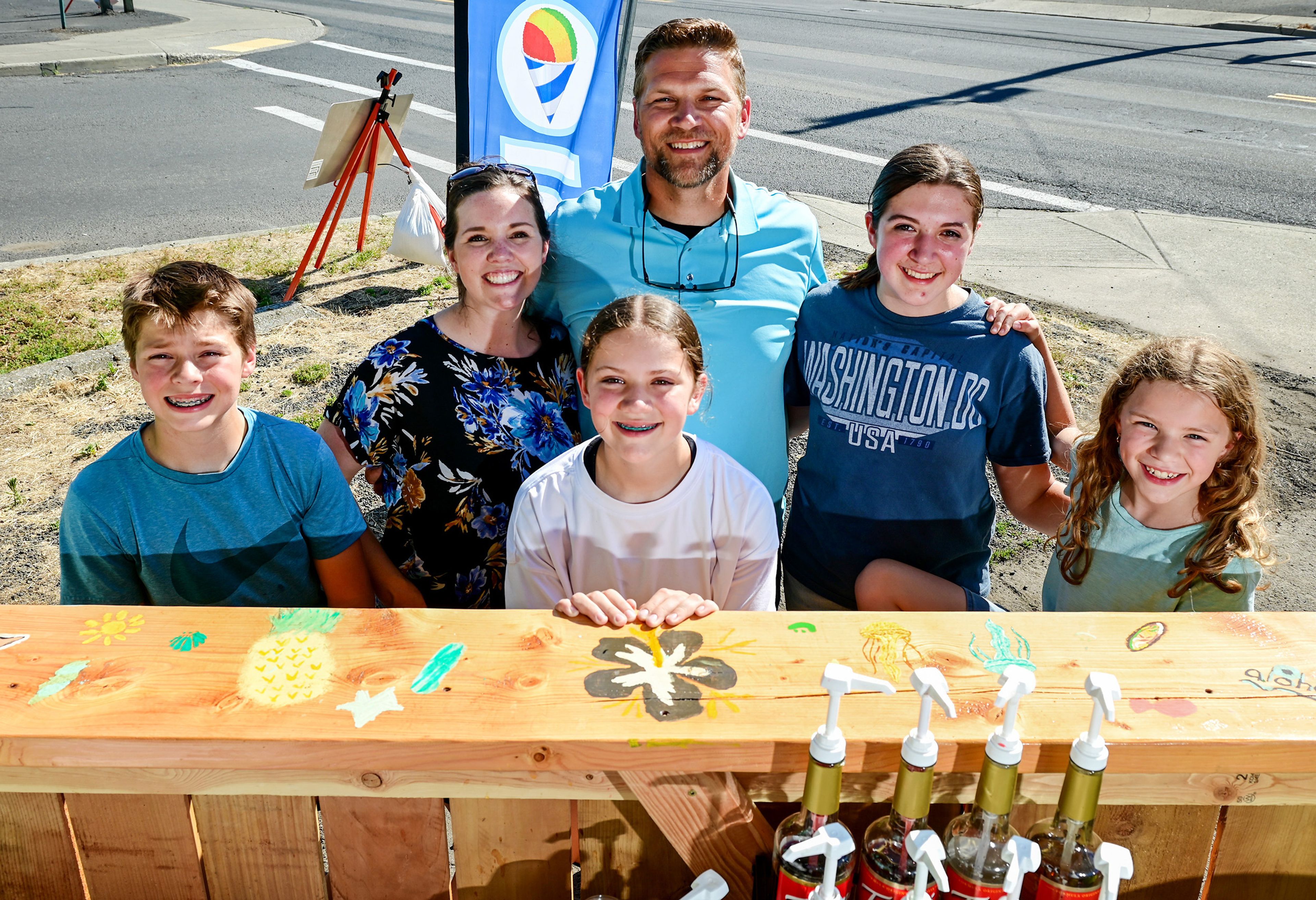 Parents Cassi and Dan Fitzgerald stand with children, from left, Hudson, 11, Bethany, 13, Addyson, 15, and Naomi, 9, at new shaved ice spot Shiver Shack in Pullman on Tuesday. The four children operate the business while Dan and Cassi serve as investors and consultants.