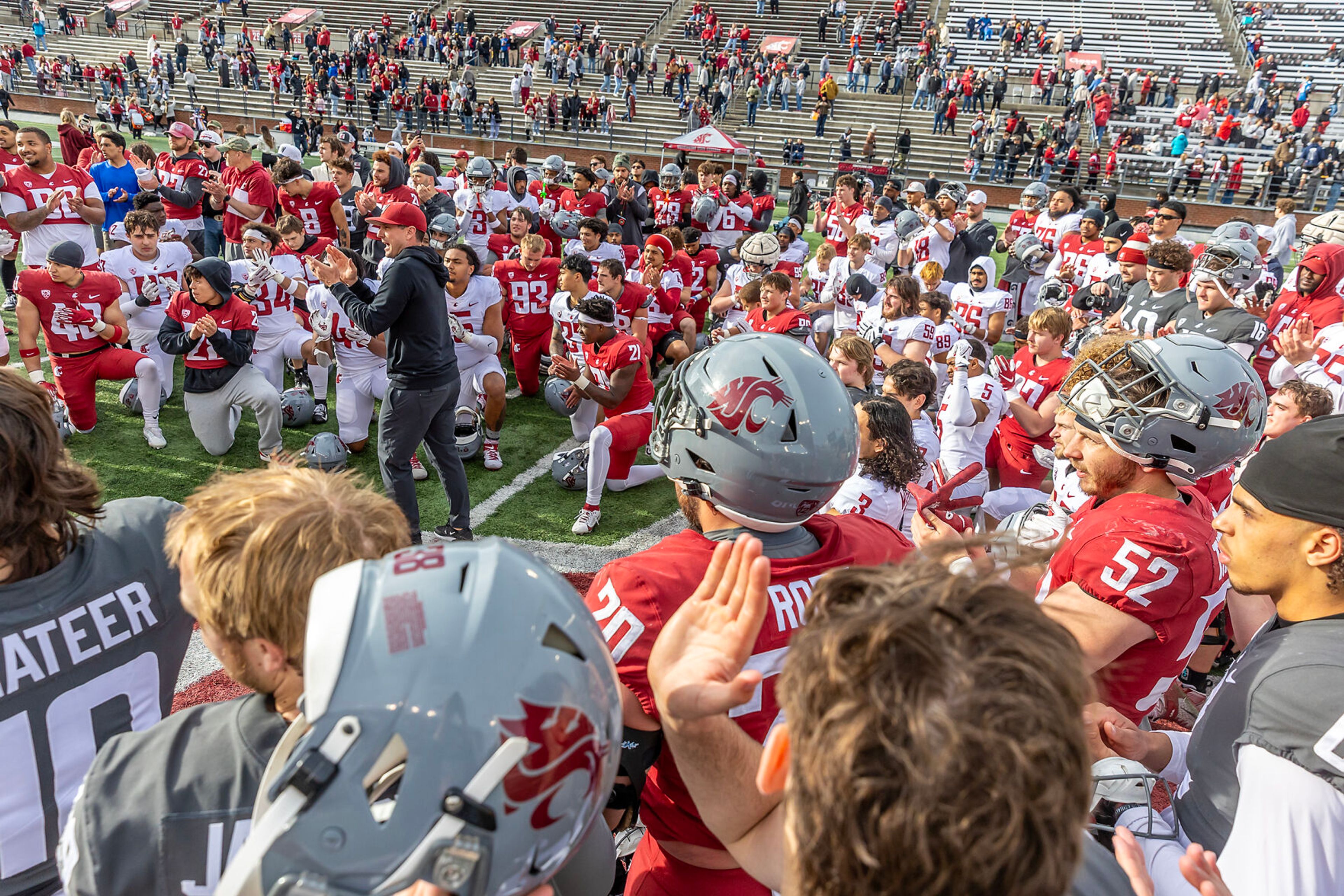 Washington State head coachJake Dicker talks to the team following the Crimson and Gray Game at Washington State University in Pullman.