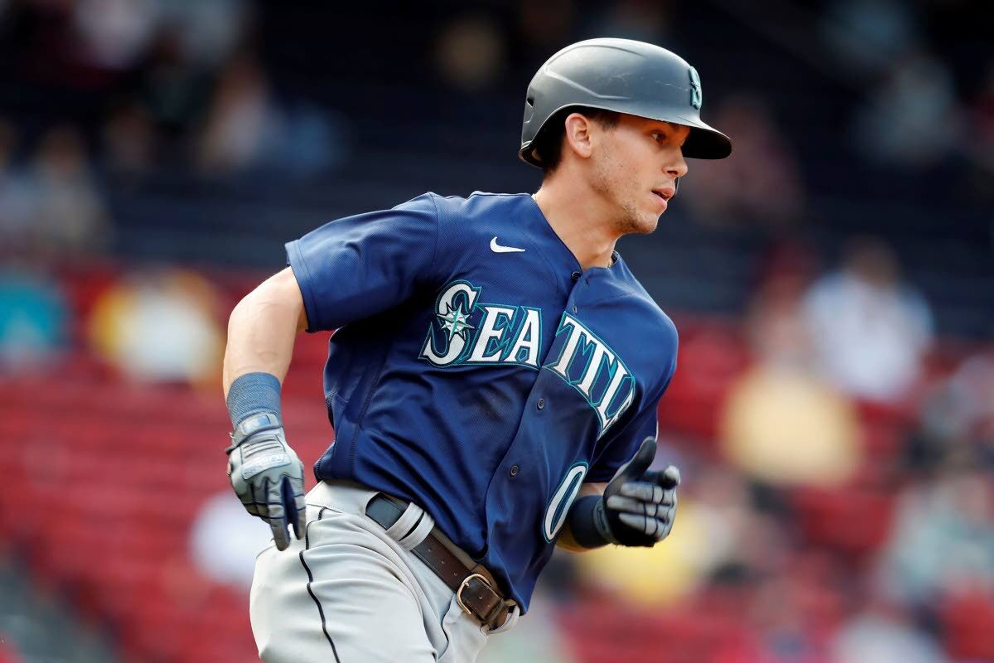 Seattle Mariners' Sam Haggerty rounds first base on his solo home run during the eighth inning of a baseball game against the Boston Red Sox, Saturday, April 24, 2021, in Boston. (AP Photo/Michael Dwyer)