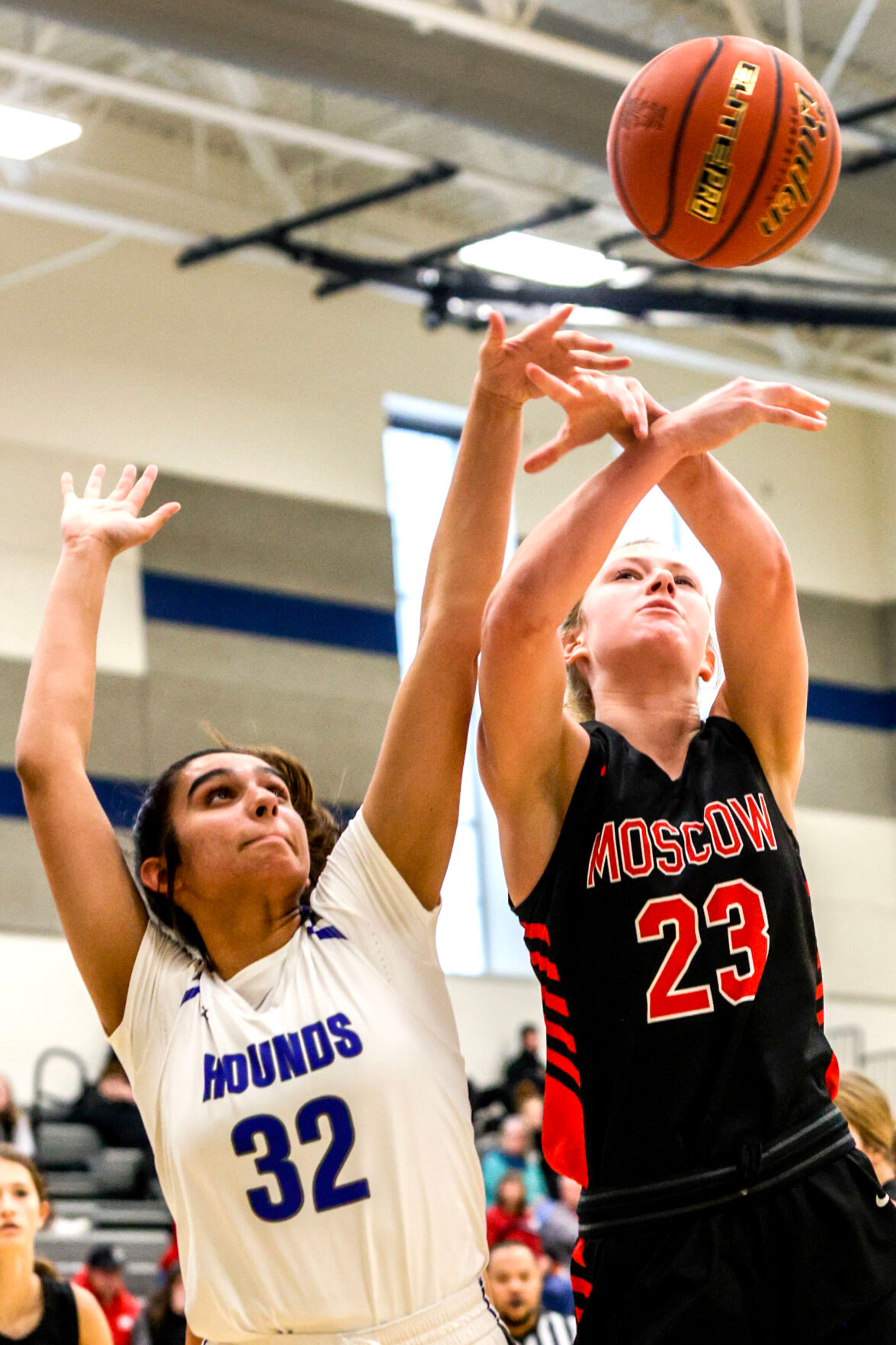 Moscow forward Jessa Skinner, right, loses the ball on a layup as Pullman post Sehra Singh defends during Saturday's nonleague girls basketball game.