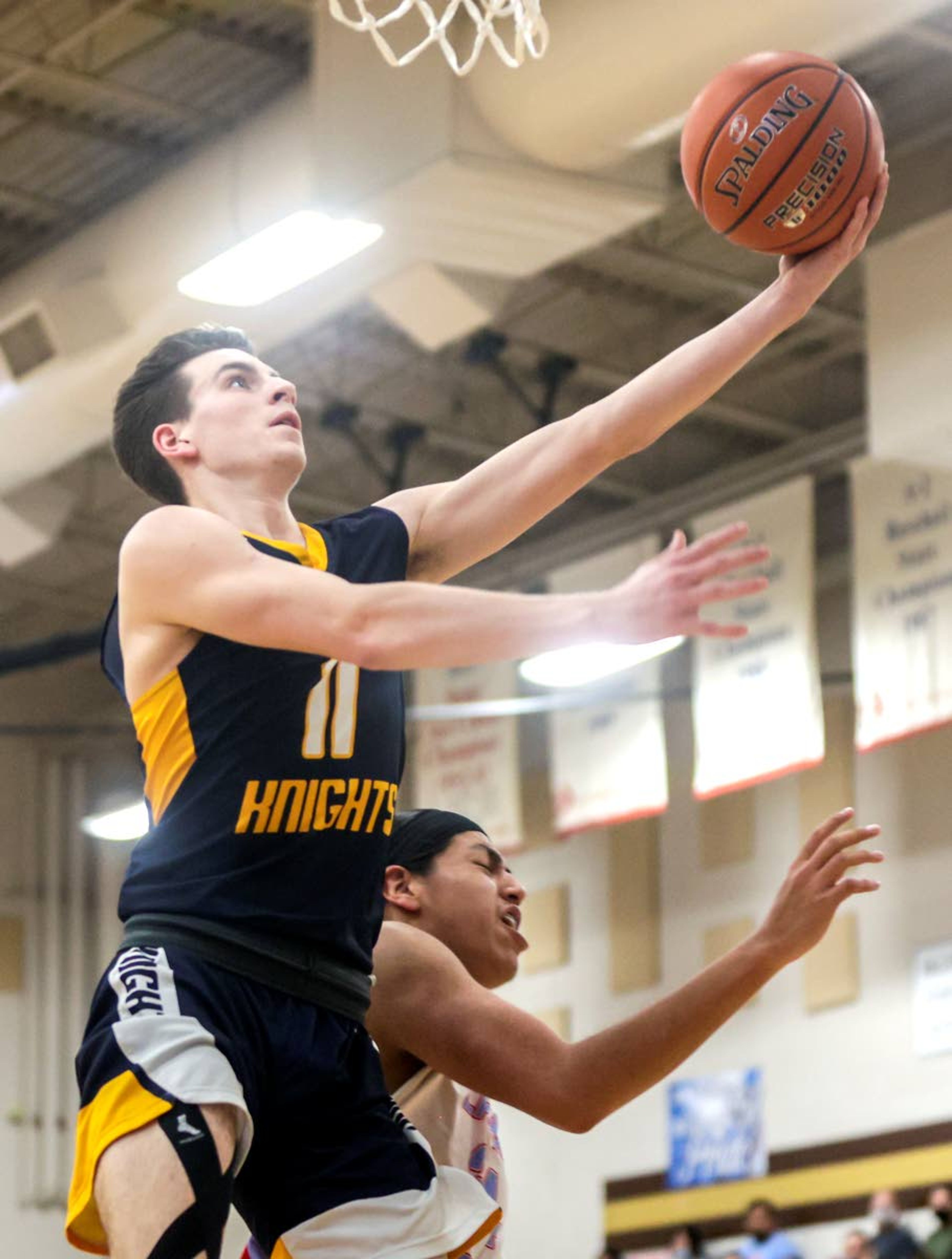 Logos Roman Nutbrock goes up for a shot against Lapwai during round two of the Idaho High School boys state basketball tournament at Vallivue High School on Friday.