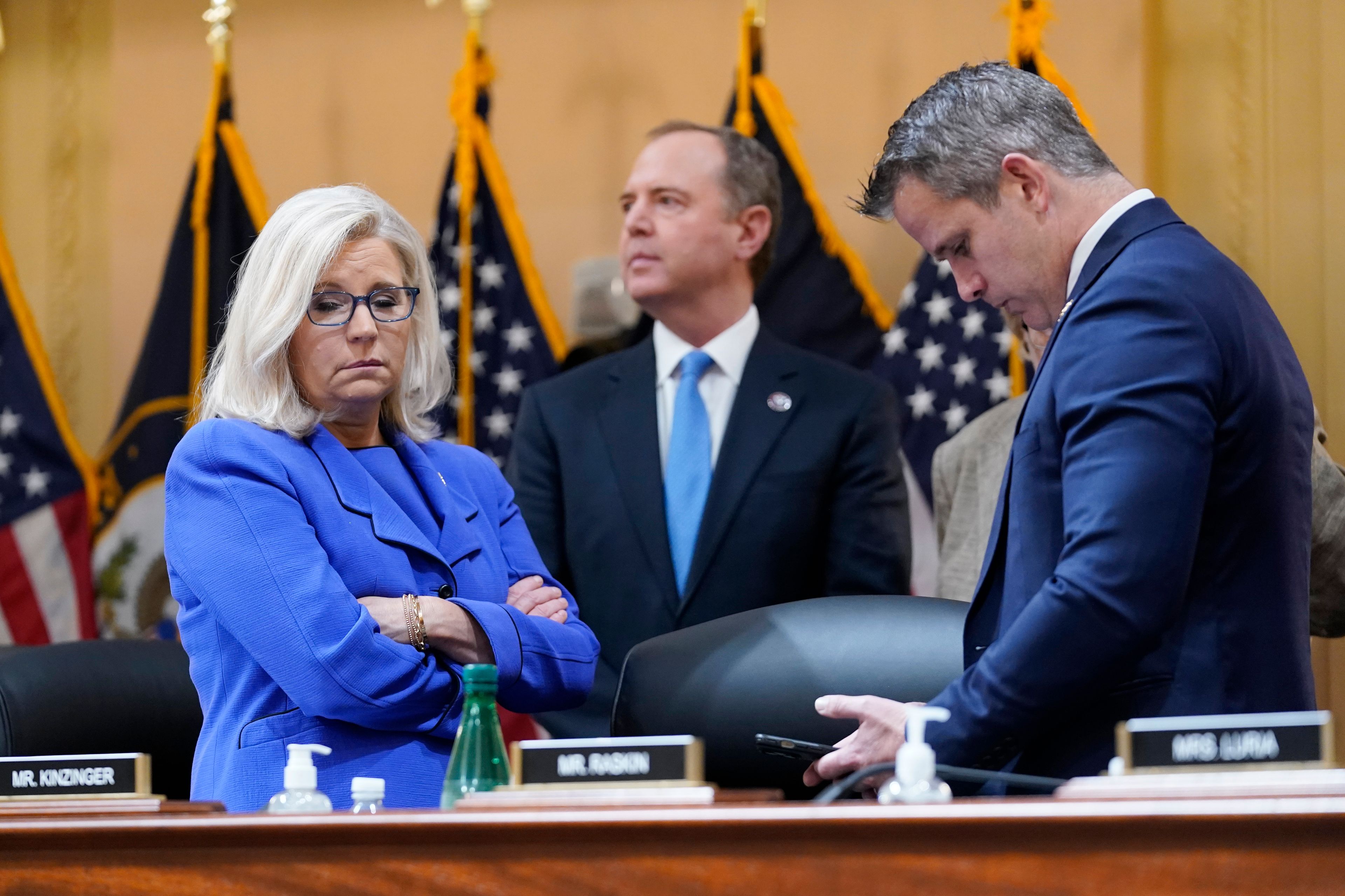 Vice Chair Liz Cheney, R-Wyo., Rep. Adam Schiff, D-Calif., and Rep. Adam Kinzinger, R-Ill., stand together during a break as the House select committee investigating the Jan. 6 attack on the U.S. Capitol holds its first public hearing to reveal the findings of a year-long investigation, at the Capitol in Washington, Thursday, June 9, 2022. (AP Photo/J. Scott Applewhite)