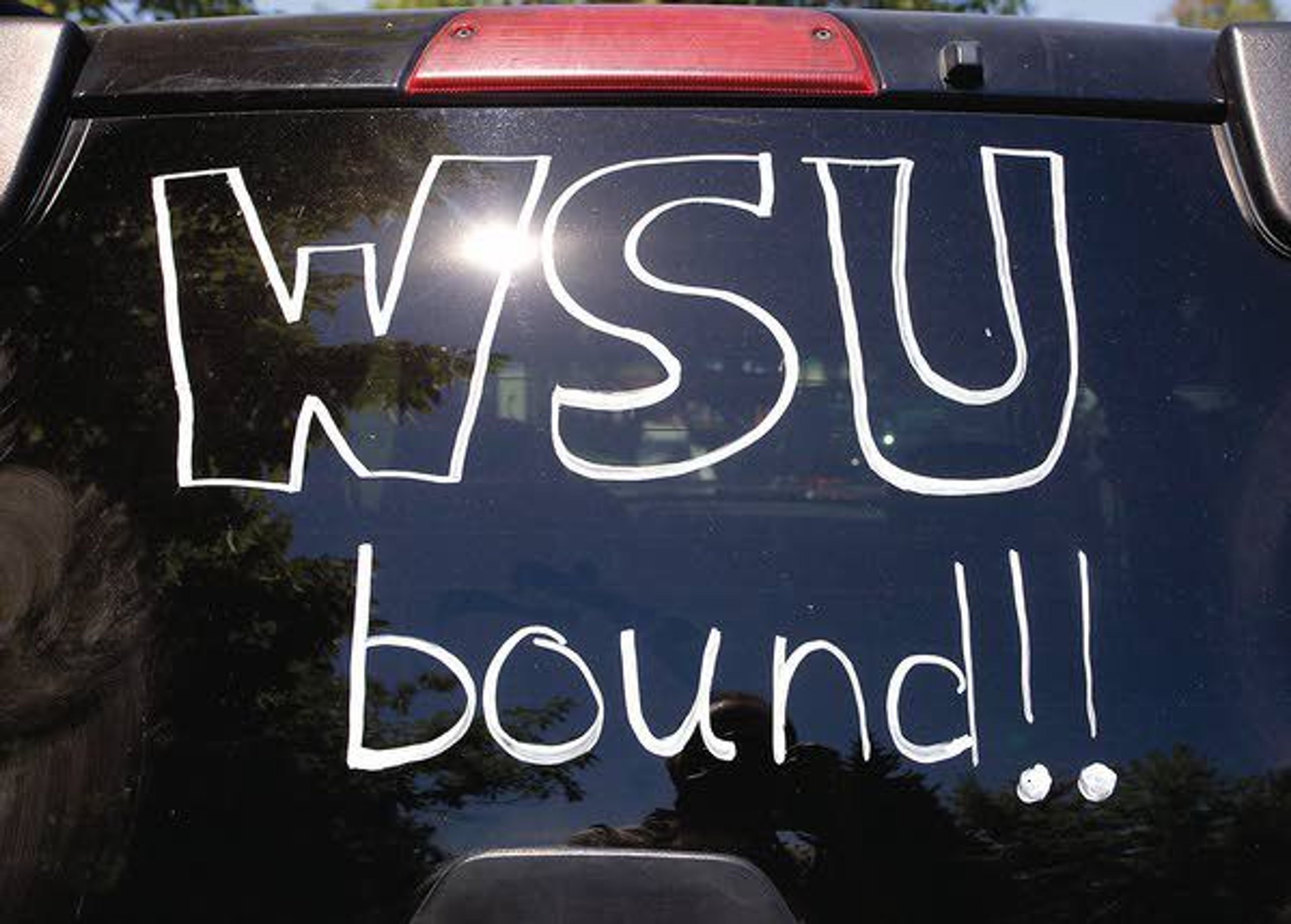 A Washington State University student's vehicle is parked outside a residence hall on Wednesday in Pullman