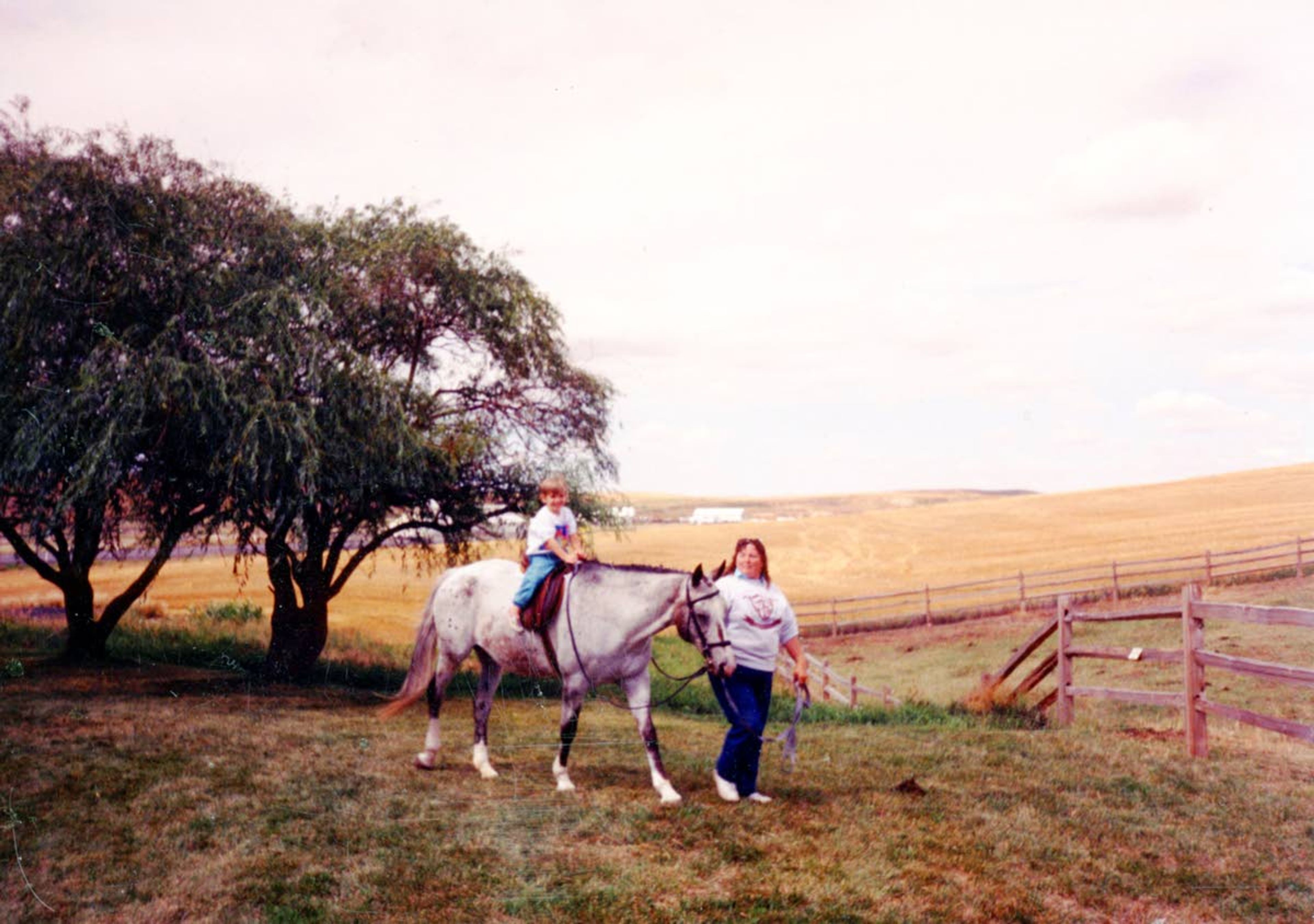 A child enjoys taking part in a horse riding demonstration at the Appaloosa Horse Club in 1992.