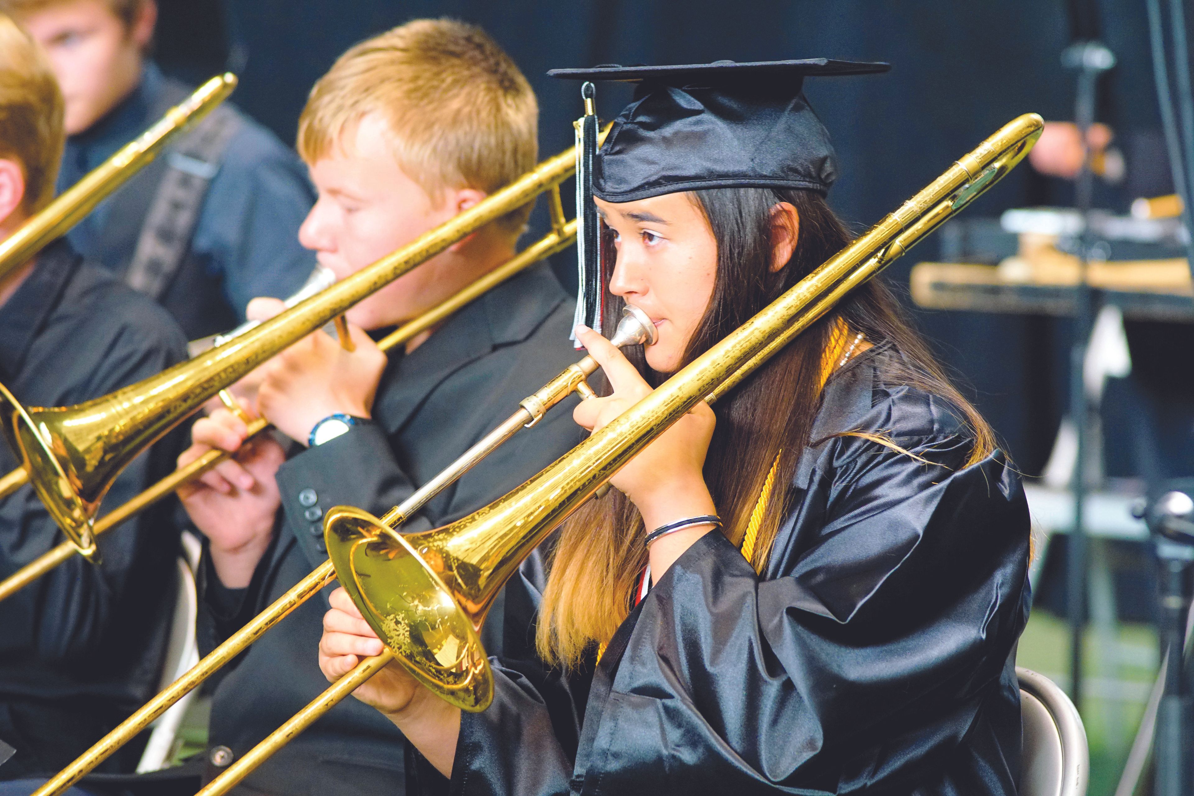 Lyssa Blood plays trombone with the Moscow High School band shortly before graduating Friday night during a ceremony in the University of Idaho Kibbie Dome.