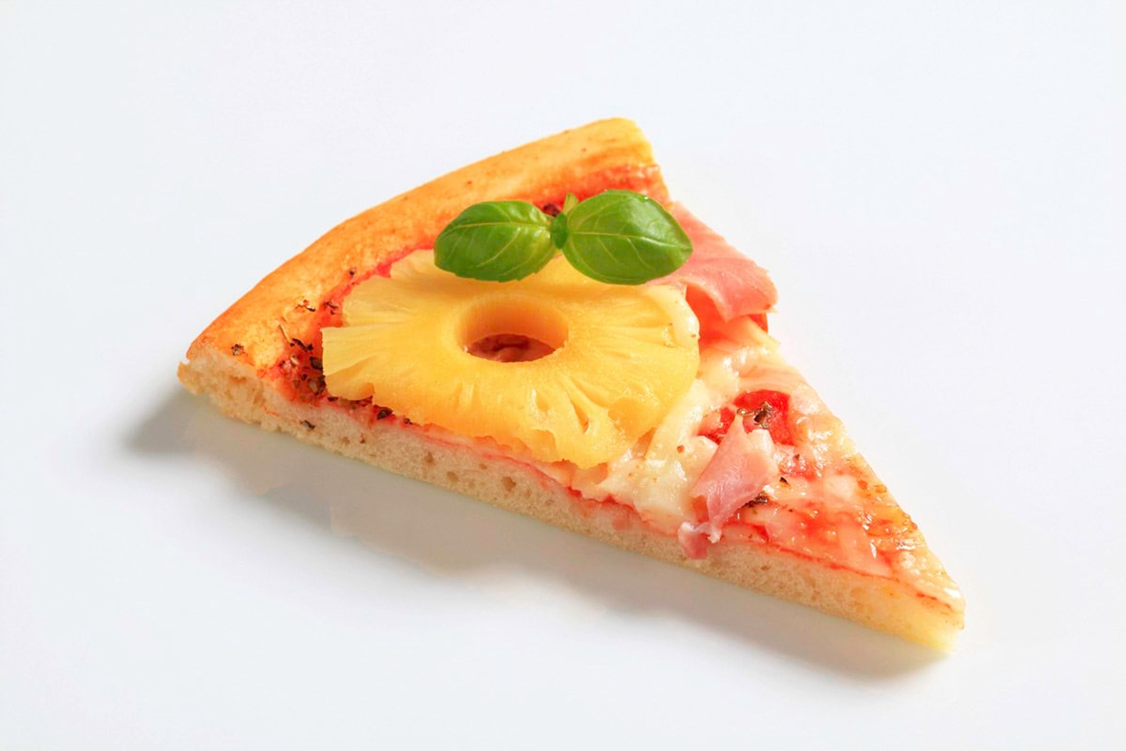 Pineapple on pizza? The most divisive food debates. Photo credit: Depositphotos.