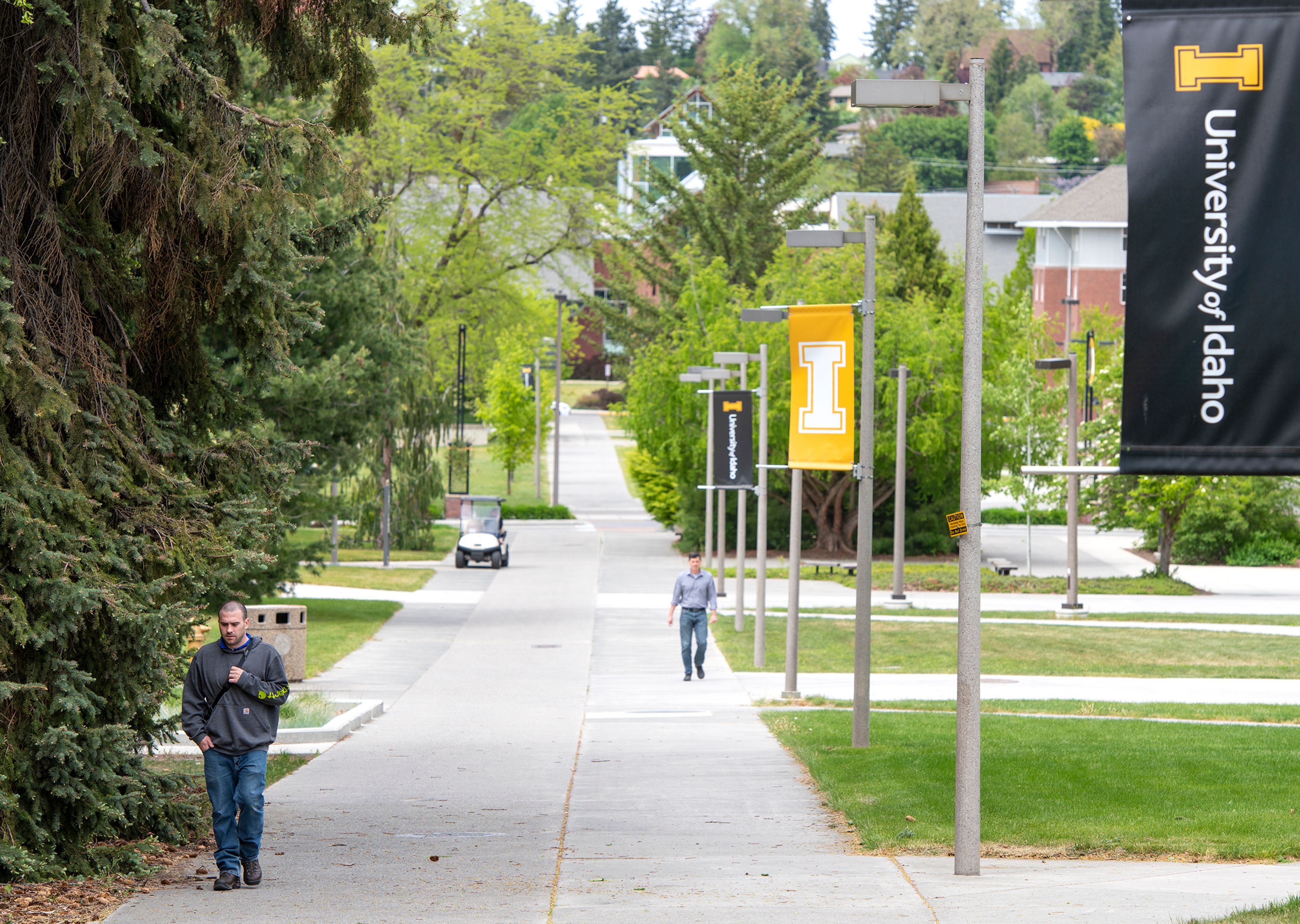 Unmasked walkers make their way through the University of Idaho campus the day after Moscow City Council lifted the town’s face mask order. Although the university removed the face covering requirement, the Moscow School District plans to require face coverings until the end of the semester.