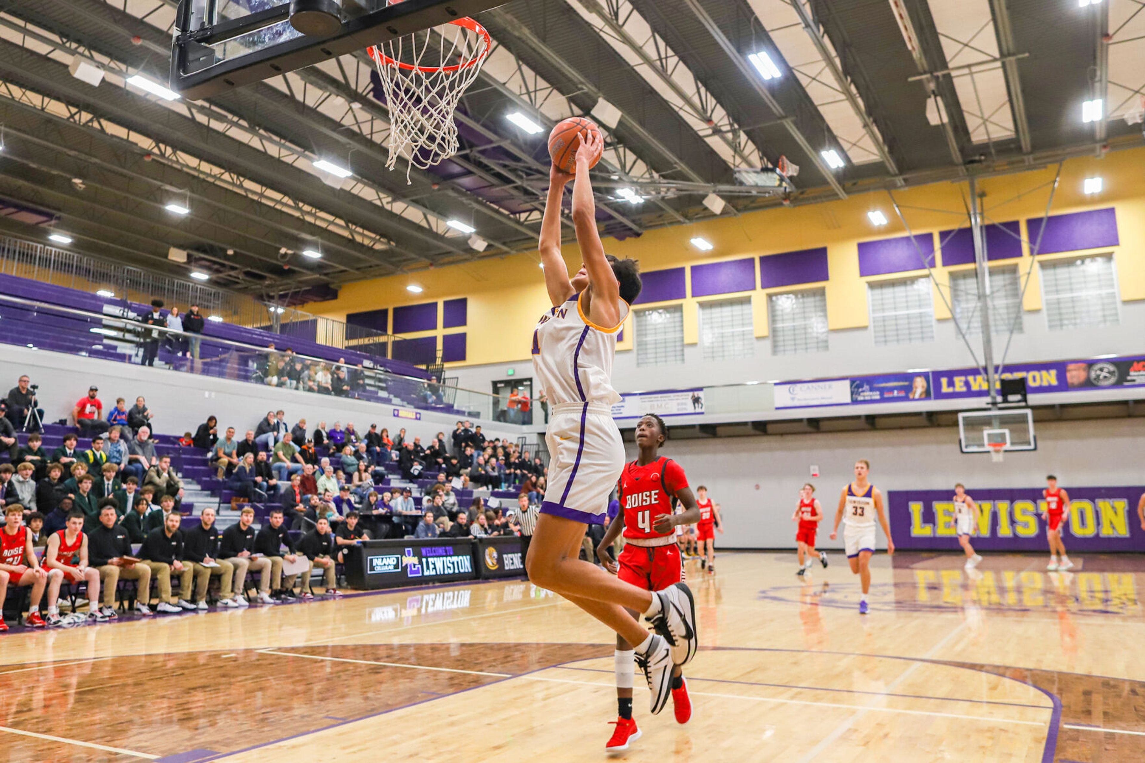 Lewiston's Rylan Gomez goes up for a dunk after stealing the ball from Boise's guard Stive Ndabarishe during Friday's nonleague boys basketball game.