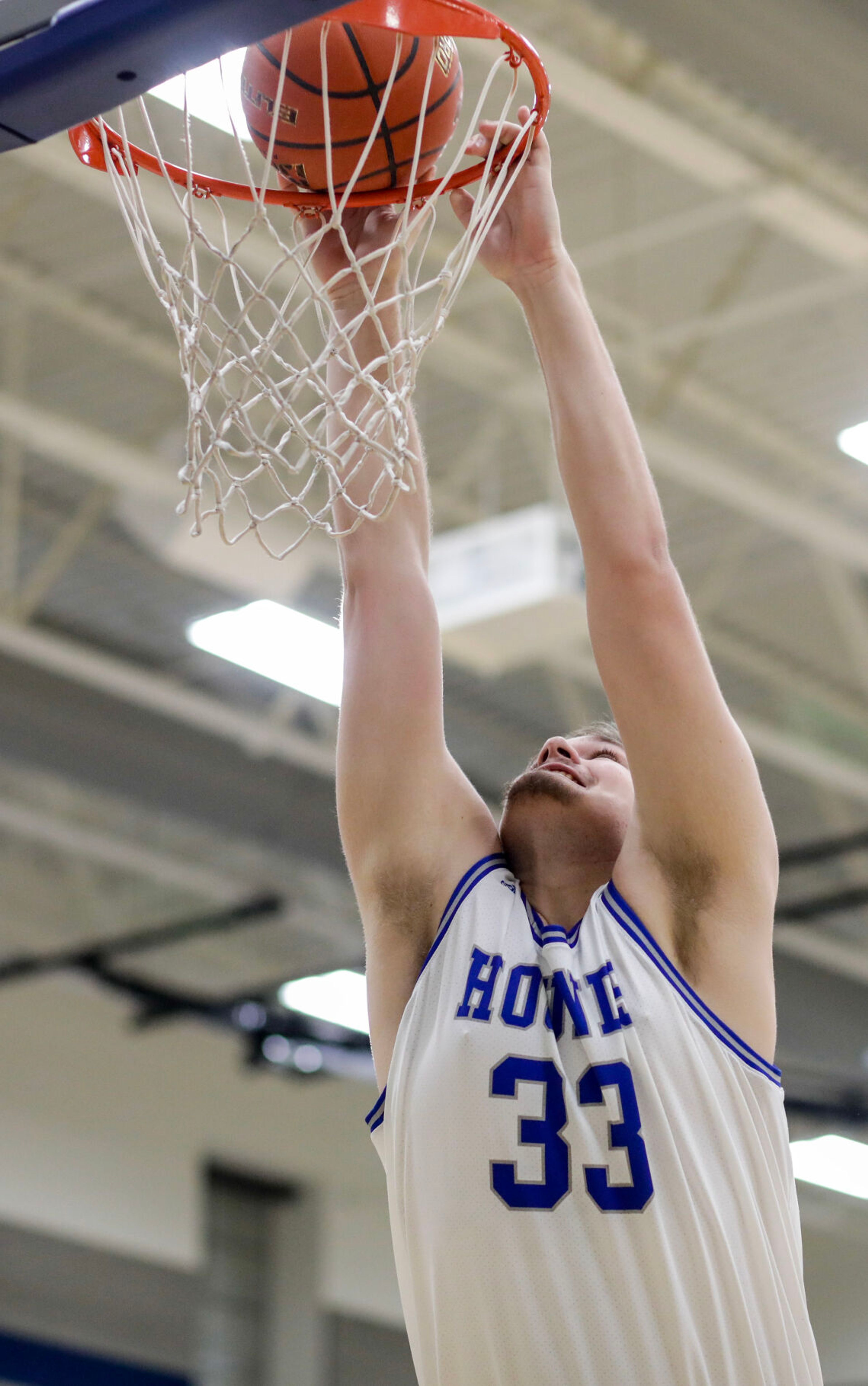 Pullman center Austin Hunt goes for a dunk but bounces the ball off the rim during Saturday's nonleague boys basketball game against Moscow.