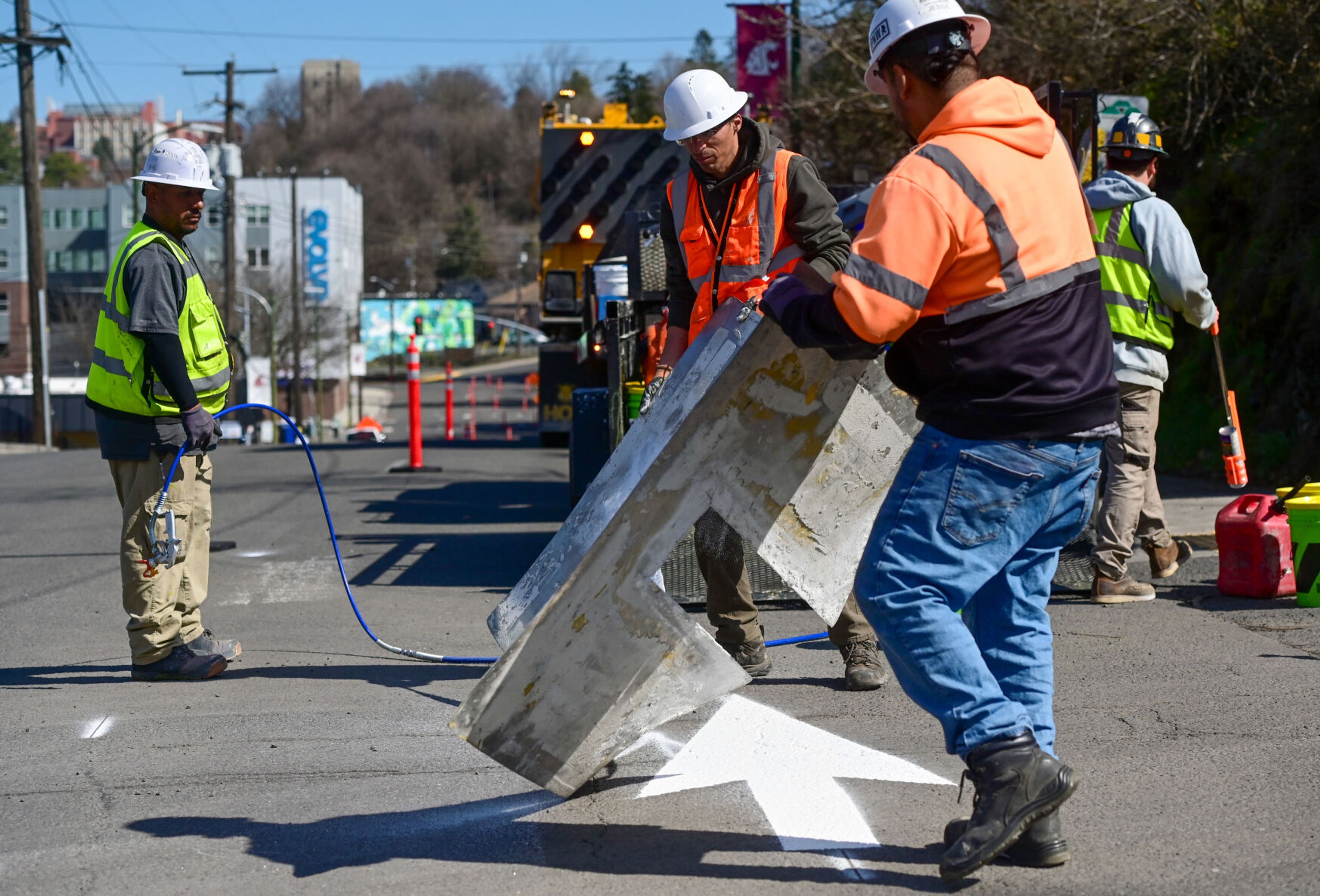 Directional arrows are painted along Paradise Street in Pullman on Monday in preparation of the street being used as a detour when Main Street is closed to vehicular traffic.