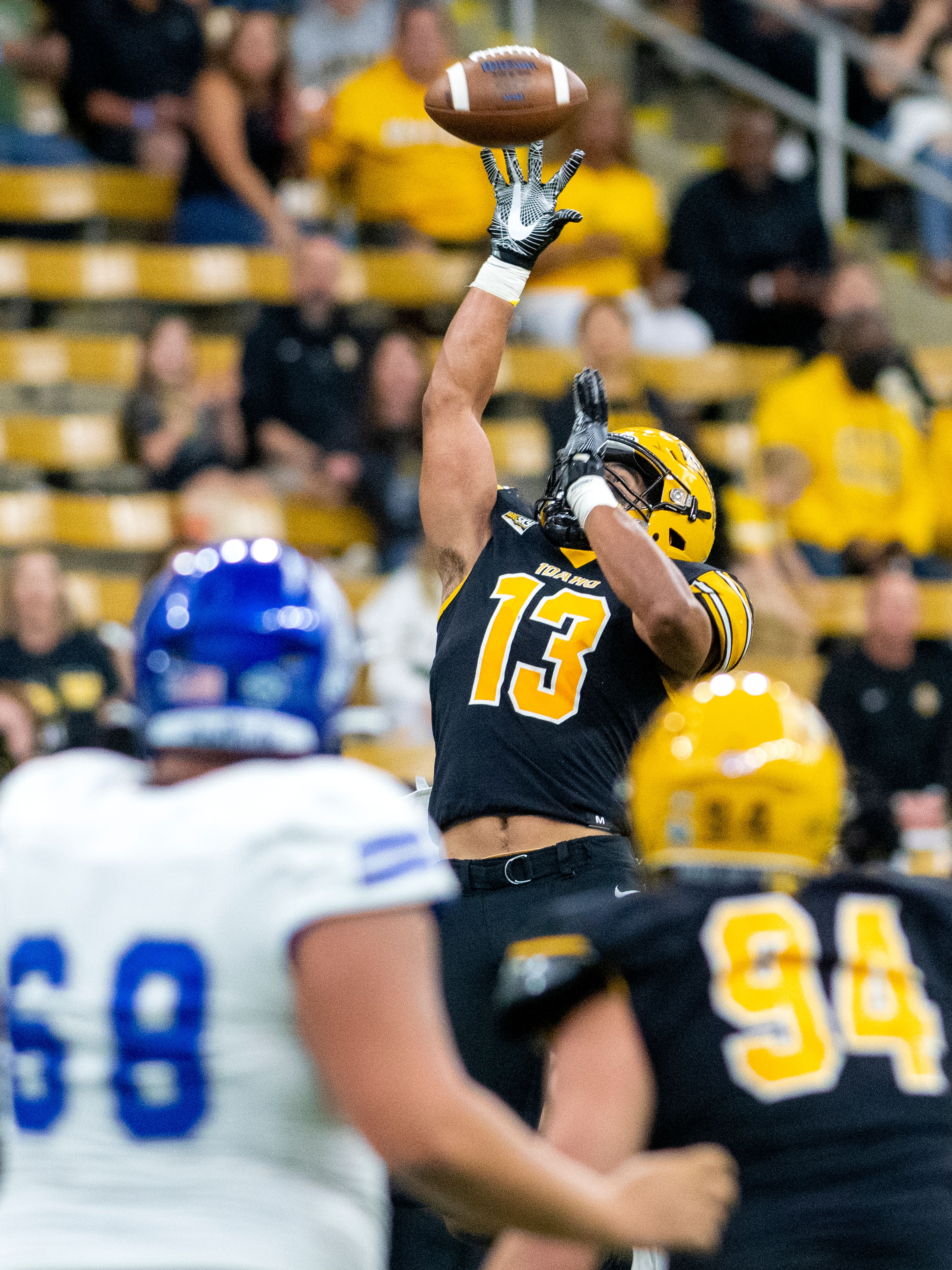 Idaho linebacker Paul Moala (13) intercepts a pass from Drake quarterback Ian Corwin (9) during the second quarter of a nonleague game Sept. 17 at the Kibbie Dome in Moscow.