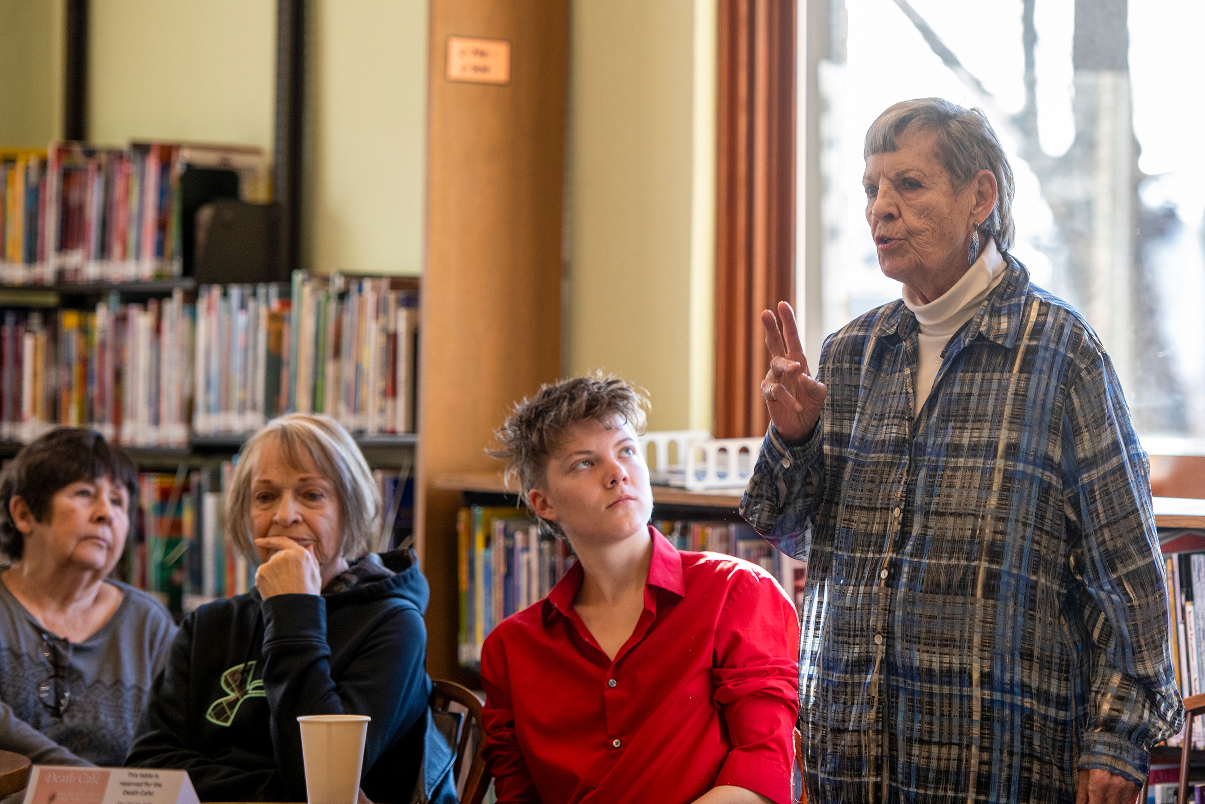 Karen Barron introduces herself during a Death Café at the Moscow Public Library on Tuesday. Barron mentioned that she is registered with the Washington State University Willed Bodied program as well as Death with Dignity.