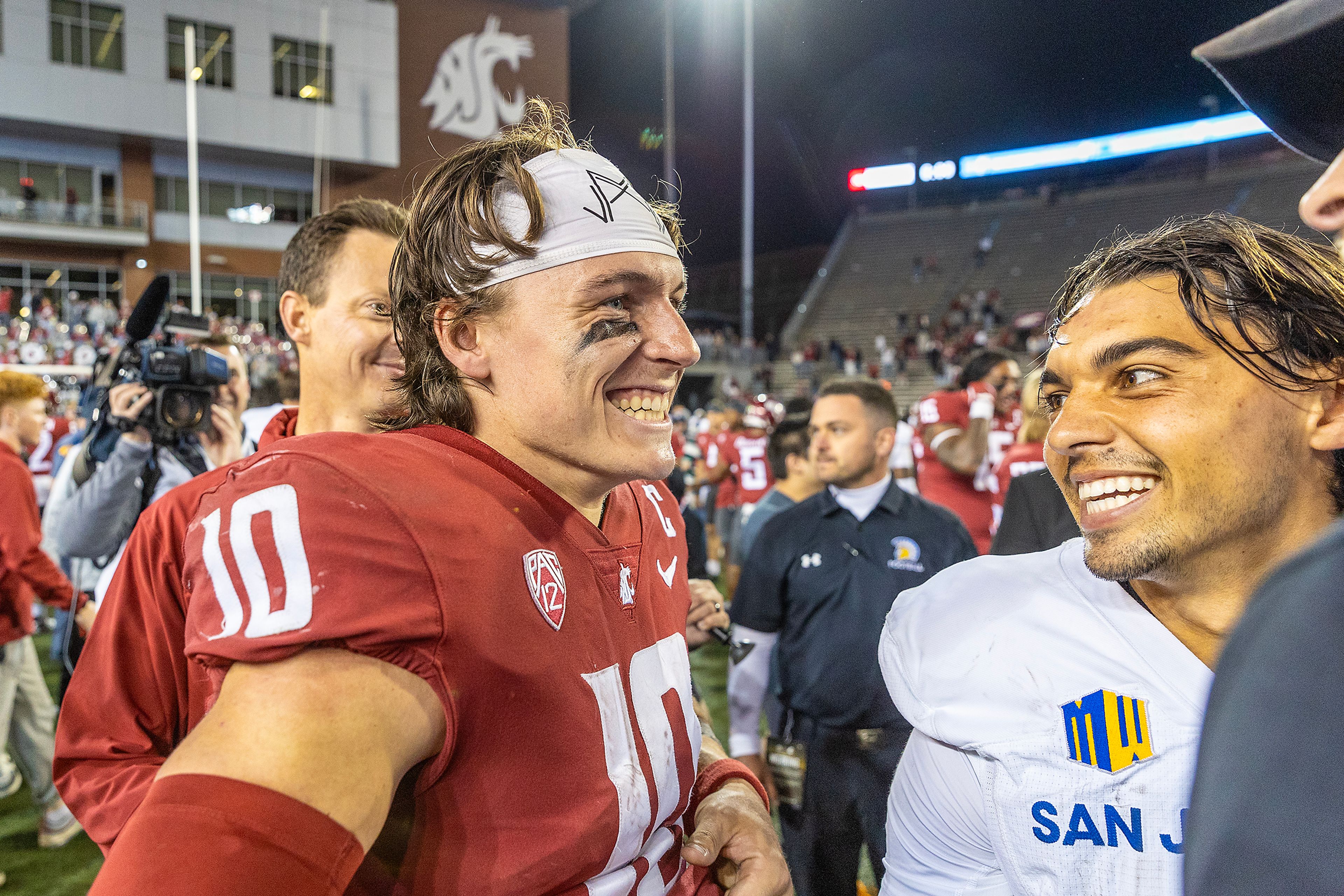 Washington State quarterback John Mateer talks with Washington State wide receiver Kyle Maxwell after the game


during a quarter of a game Friday at Gesa Field in Pullman.