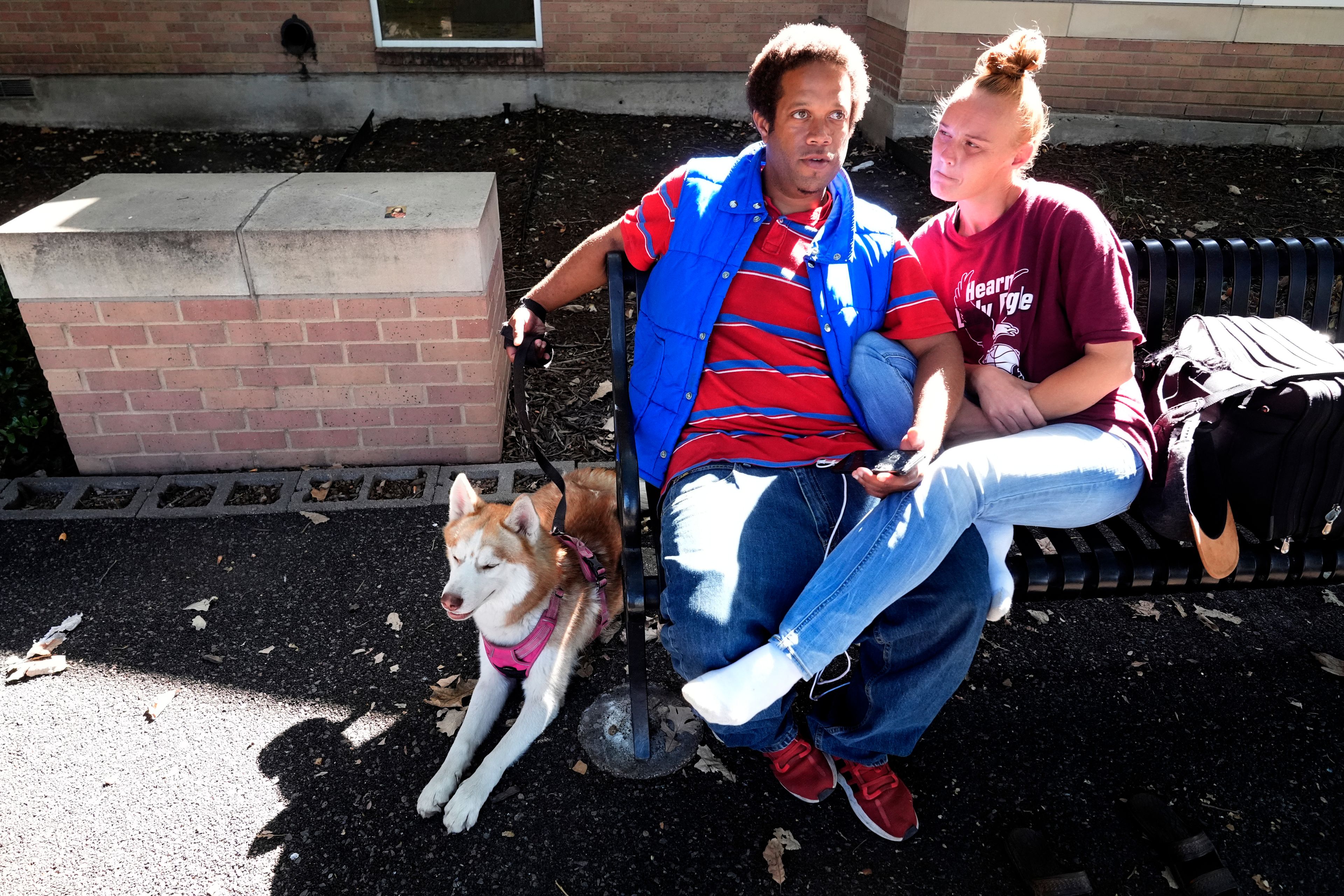 Brandon Taylor, 35, left, sits with his girlfriend Whitney Black, 35, while taking about the 2024 presidential election during an interview in Lewisville, Texas, Wednesday, Oct. 2, 2024. (AP Photo/LM Otero)