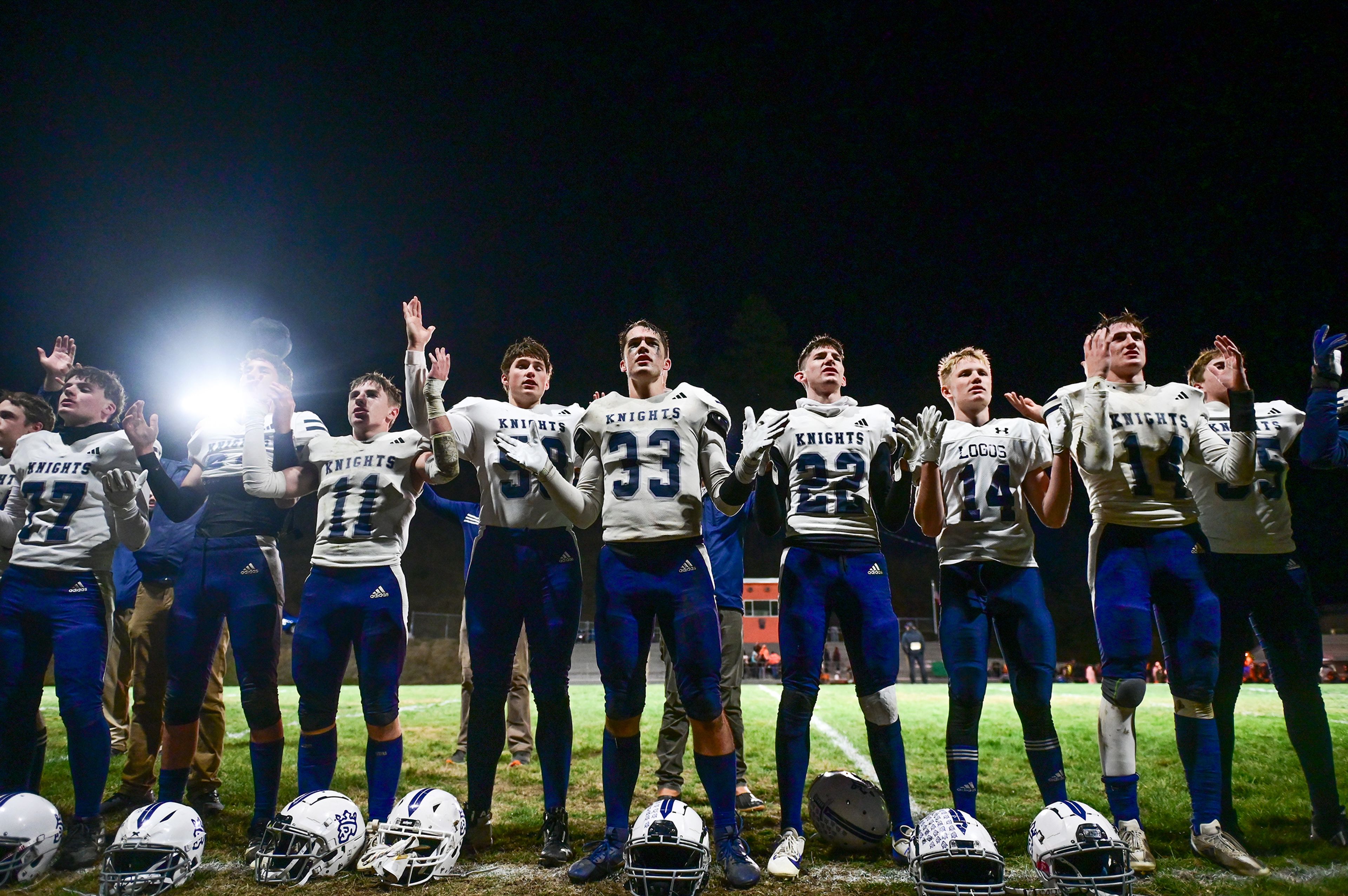 Logos players sing the doxology after a win over Kendrick Friday in Kendrick.,