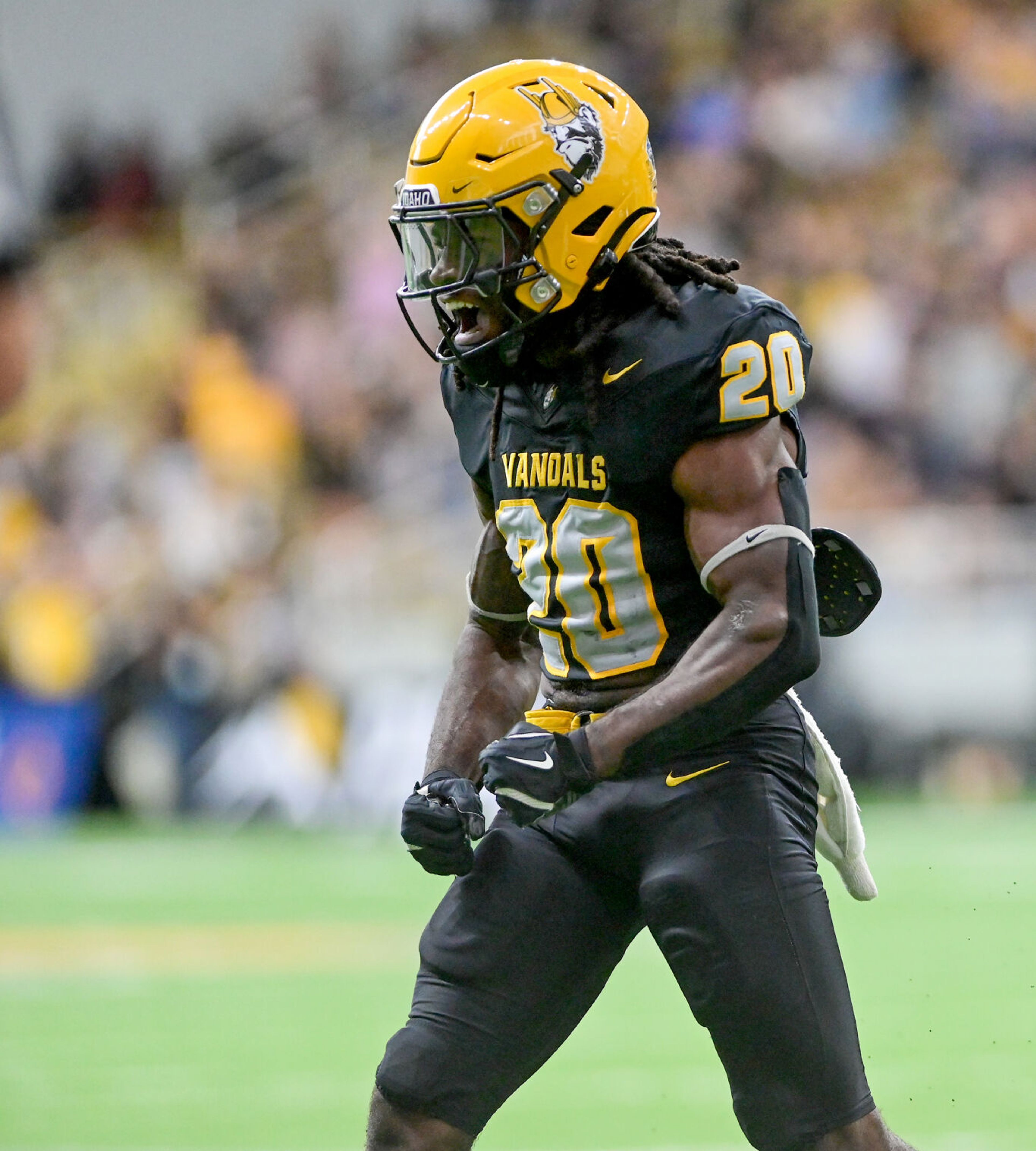 Idaho Vandals running back Elisha Cummings (20) celebrates a first down near the end zone during a game against Albany Great Danes Saturday at the P1FCU Kibbie Dome in Moscow.