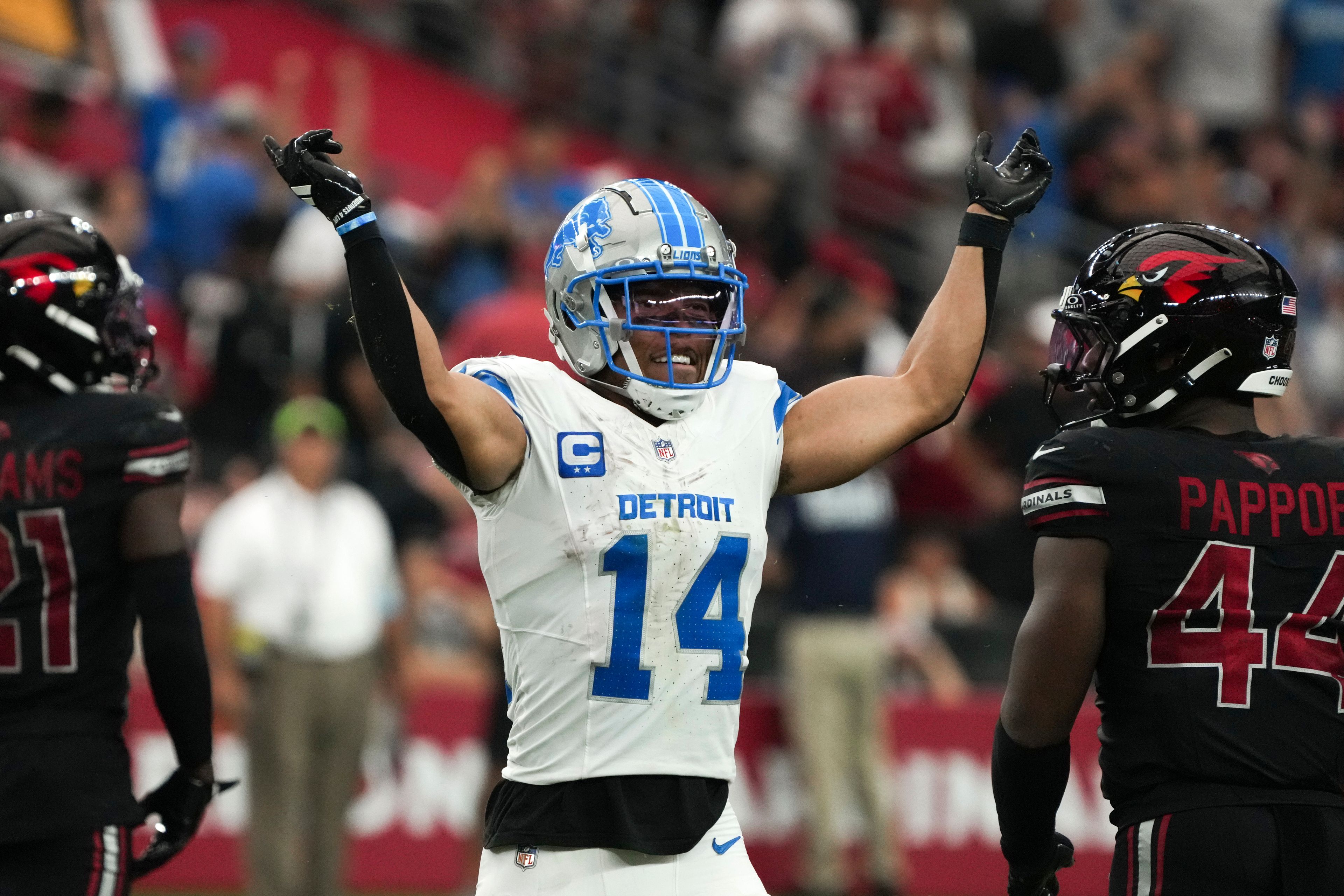 Detroit Lions wide receiver Amon-Ra St. Brown (14) reacts during the second half of an NFL football game against the Arizona Cardinals Sunday, Sept. 22, 2024, in Glendale, Ariz. (AP Photo/Rick Scuteri)