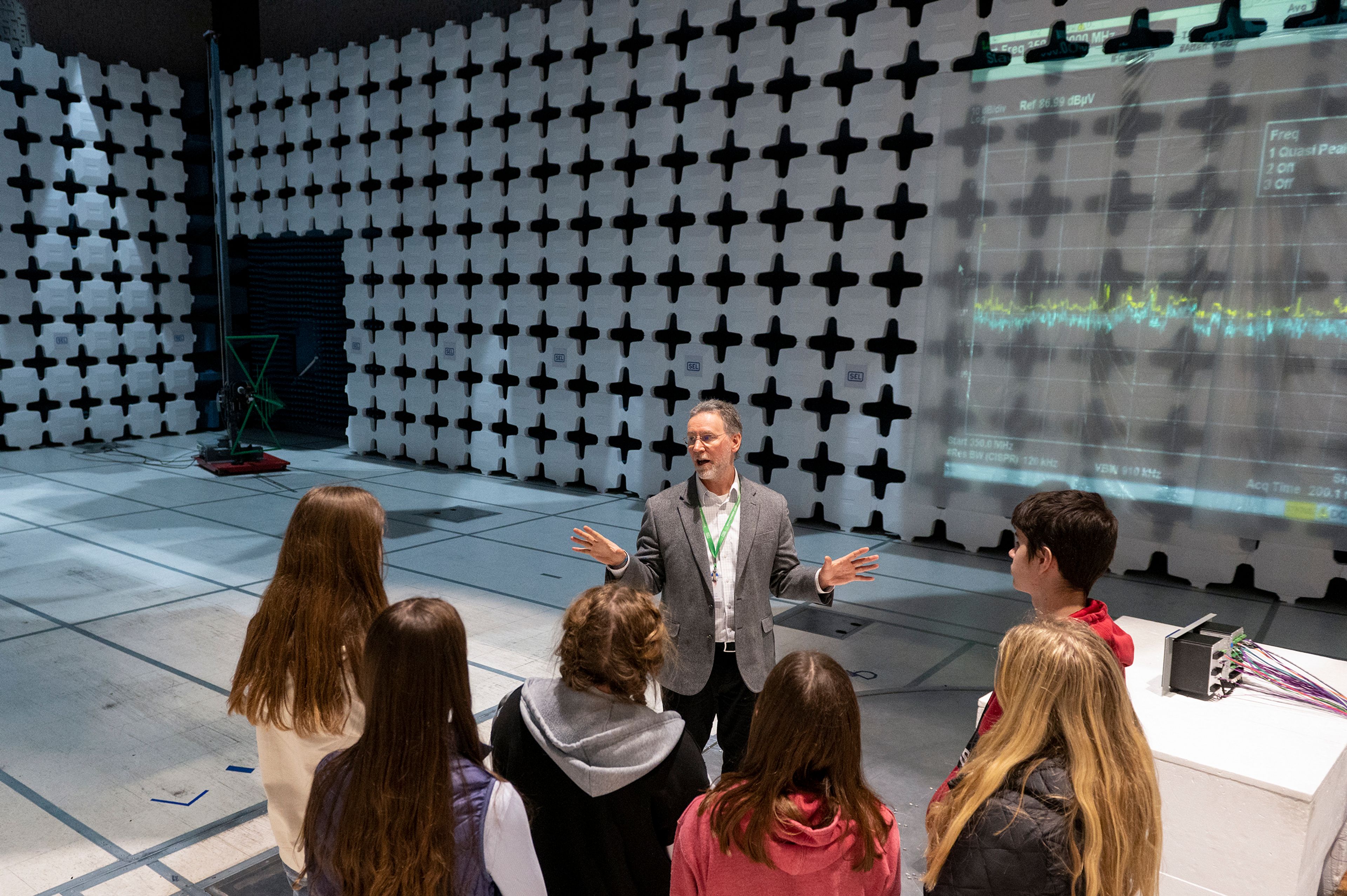 Senior Engineering Manager Scott Hodge gives a tour of a radio frequency chamber to students from All Saints Catholic School on Thursday during the annual Getting Ready for Engineering and Technology Day, or GREAT DAY at Schweitzer Engineering Laboratories in Pullman. Nathan Shirley, an All Saints student, said, “Some really cool stuff. They explained it really well and it’s exciting to be here.”