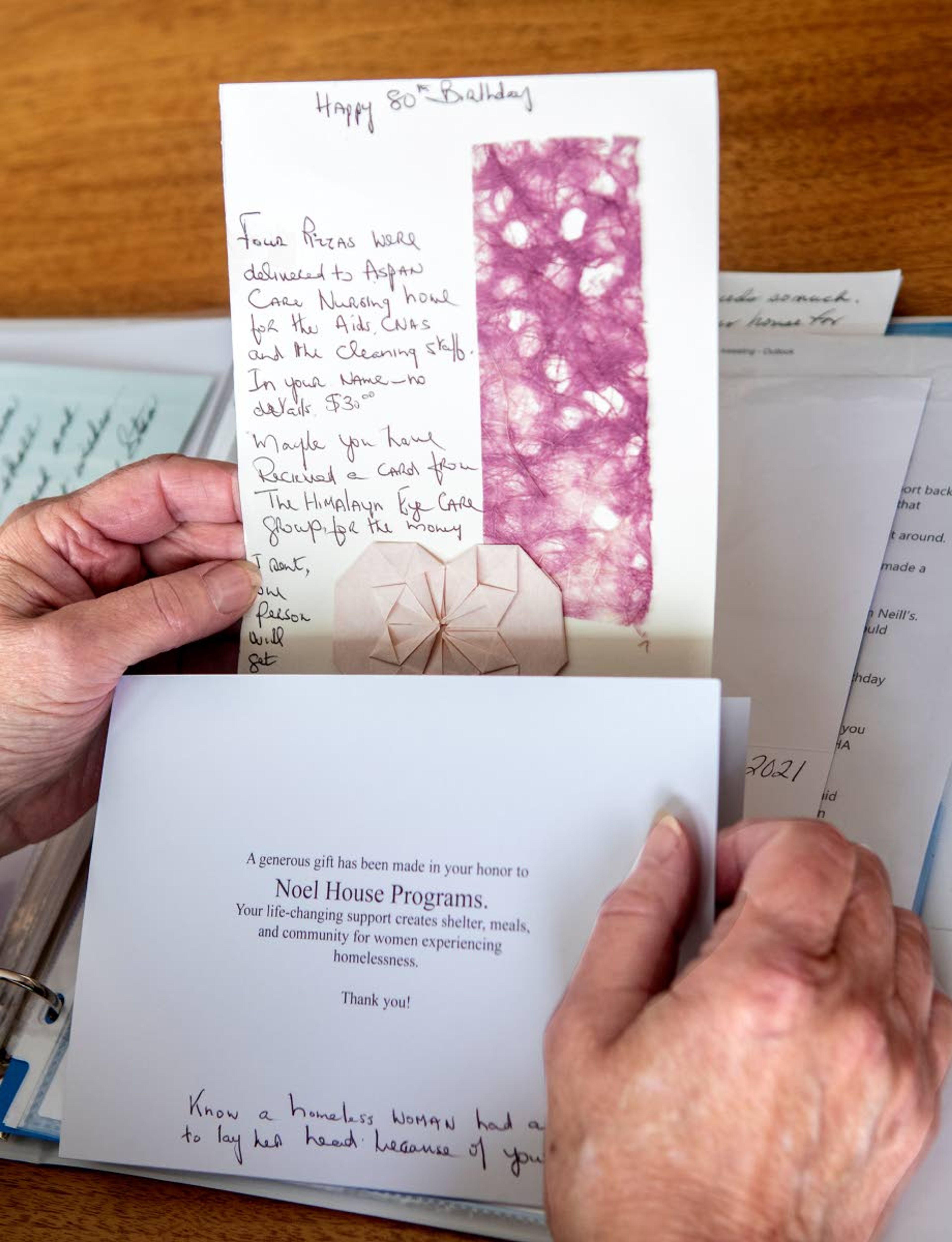 Former mayor of Pullman, Karen Kiessling, was hindered from celebrating her 80th birthday with friends and family on Feb. 10, 2021, so she adapted by sending out a letter to ten female friends that contained $80 to spend whichever way they deemed necessary, with the only request being that they must reply with how they chose to spend the money. In this image, Kiessling displays a letter from a friend that explains how the money went towards a variety of things, including food for a nursing home staff and bedding for homeless women in the community.