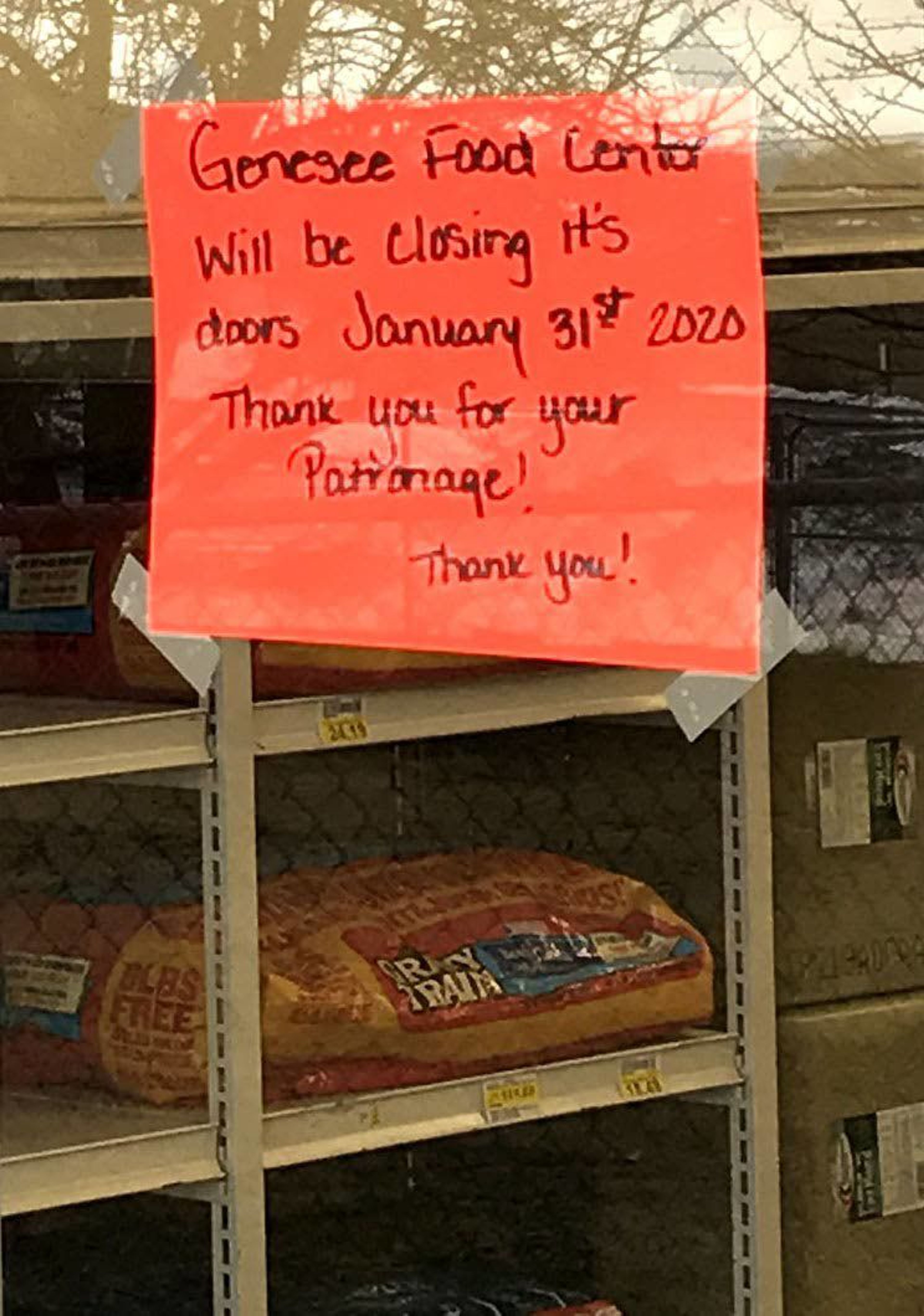 A sign at the front entrance of Genesee Food Center tells customers Friday is the last day to shop at the store before it closes.