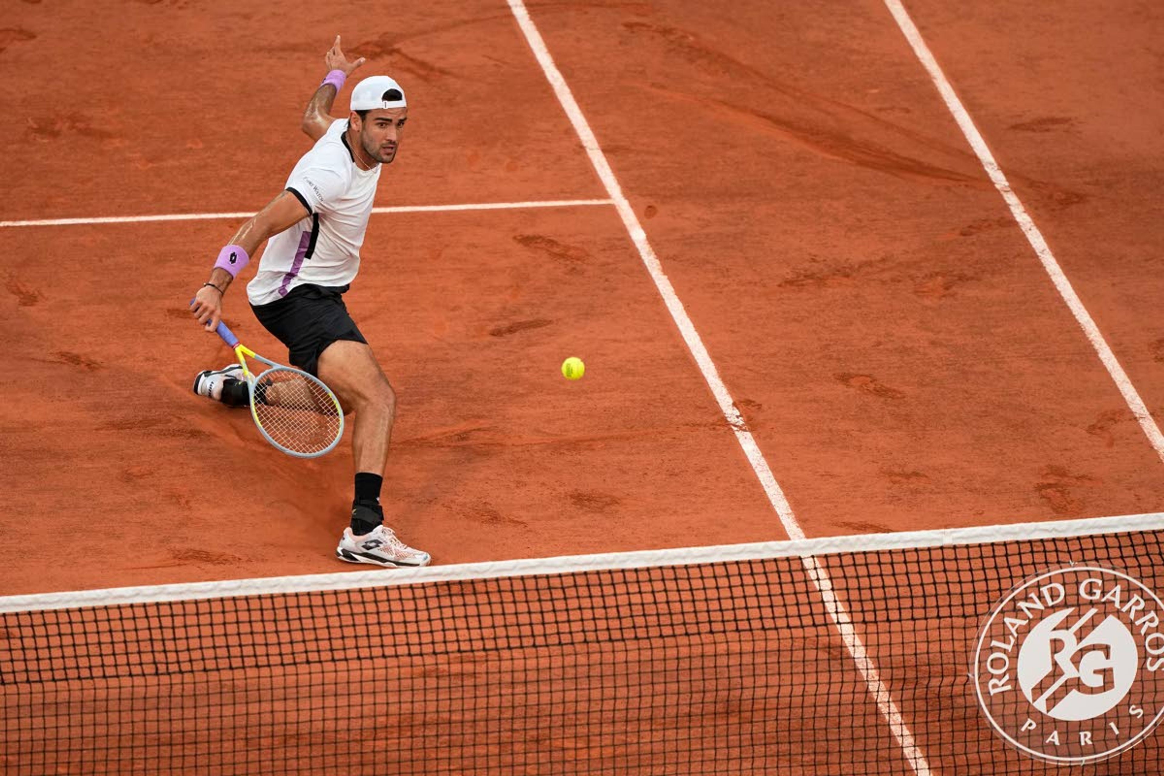 Italy's Matteo Berrettini returns the ball to Serbia's Novak Djokovic during their quarterfinal match of the French Open tennis tournament at the Roland Garros stadium Wednesday, June 9, 2021 in Paris. (AP Photo/Michel Euler)