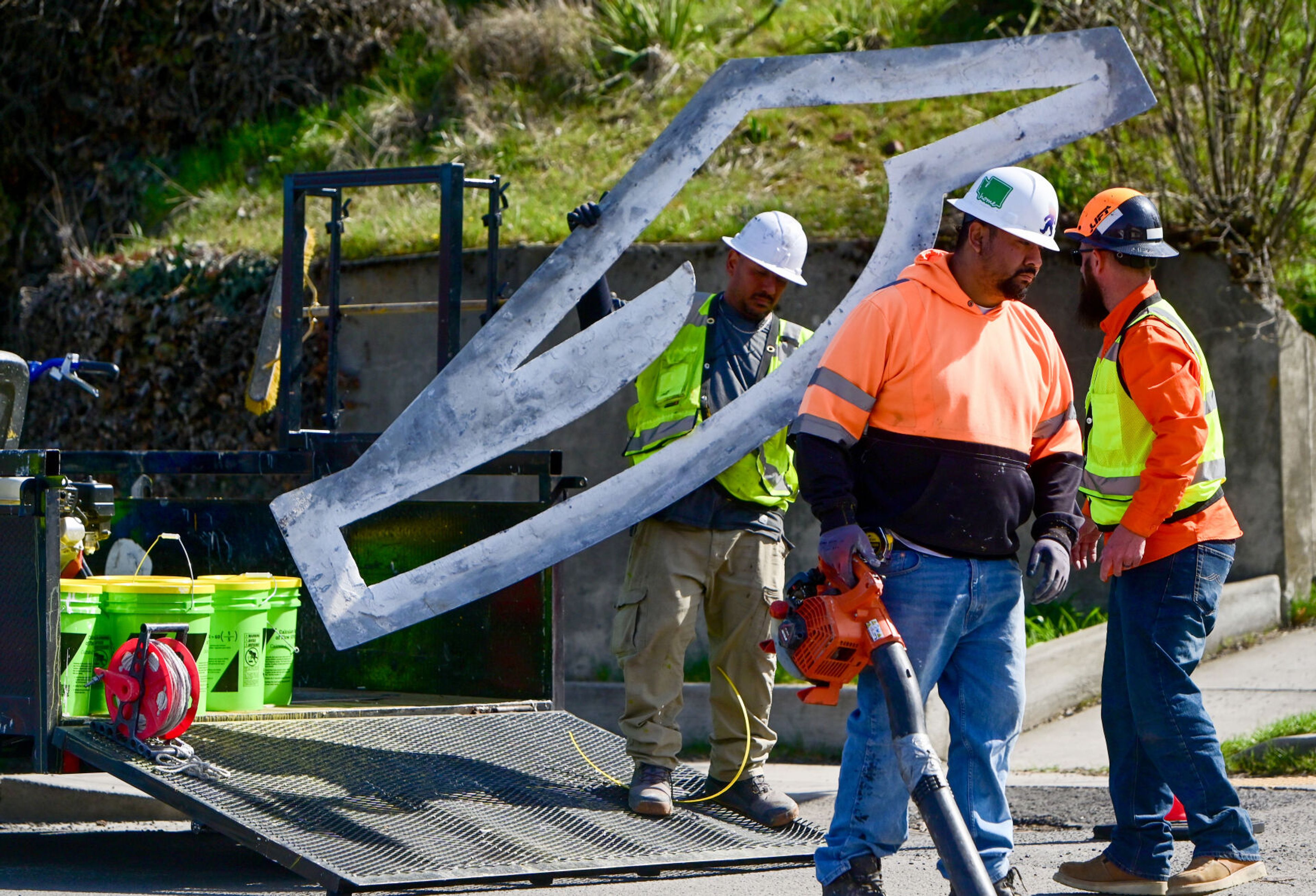 Crews work to re-stripe Paradise Street in Pullman on Monday in preparation of the street being used as a detour when Main Street is closed to vehicular traffic.